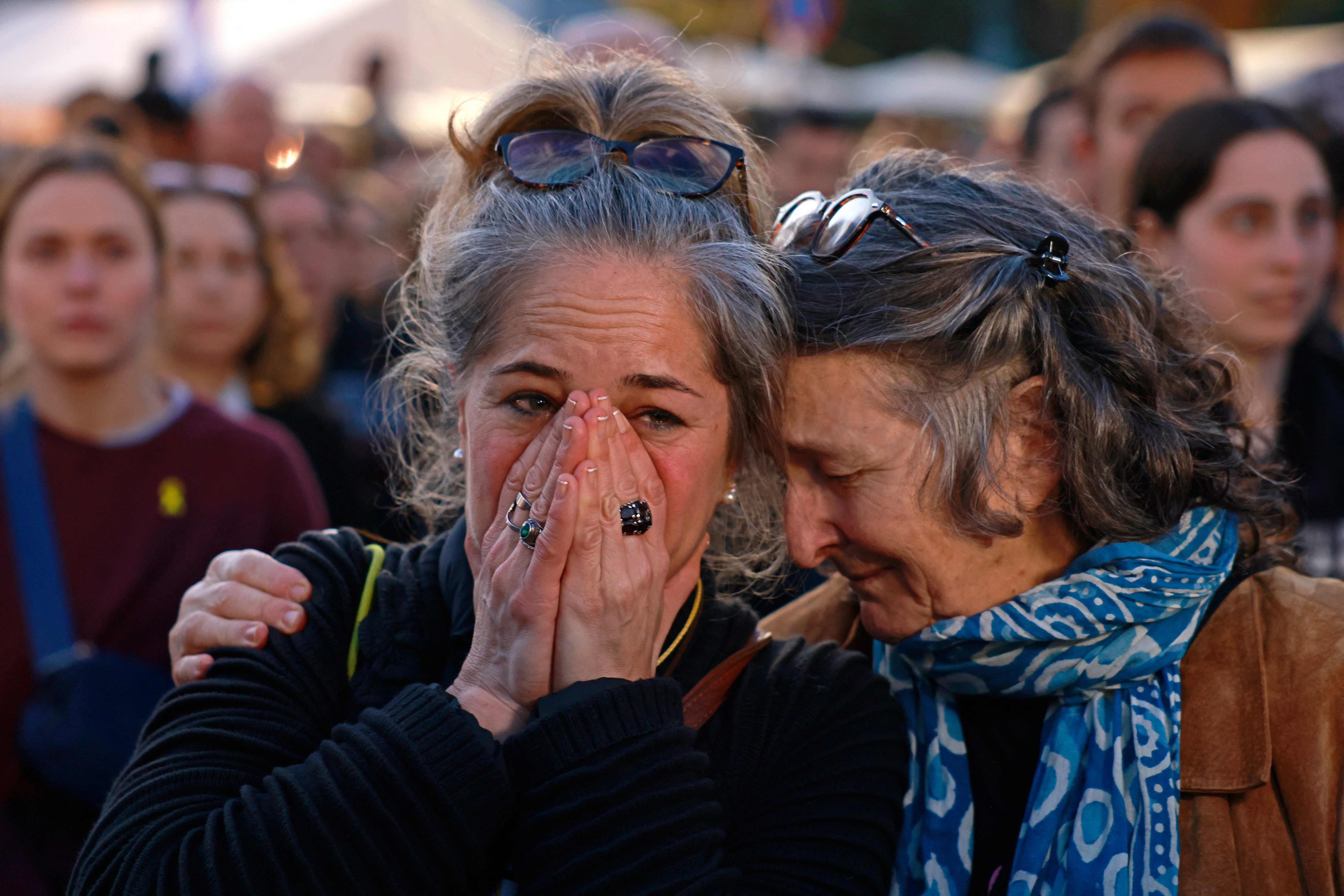 Supporters and relatives of hostages held captive in the Gaza Strip since the 7 October 2023 attacks by Palestinian militants, react as the hostages released