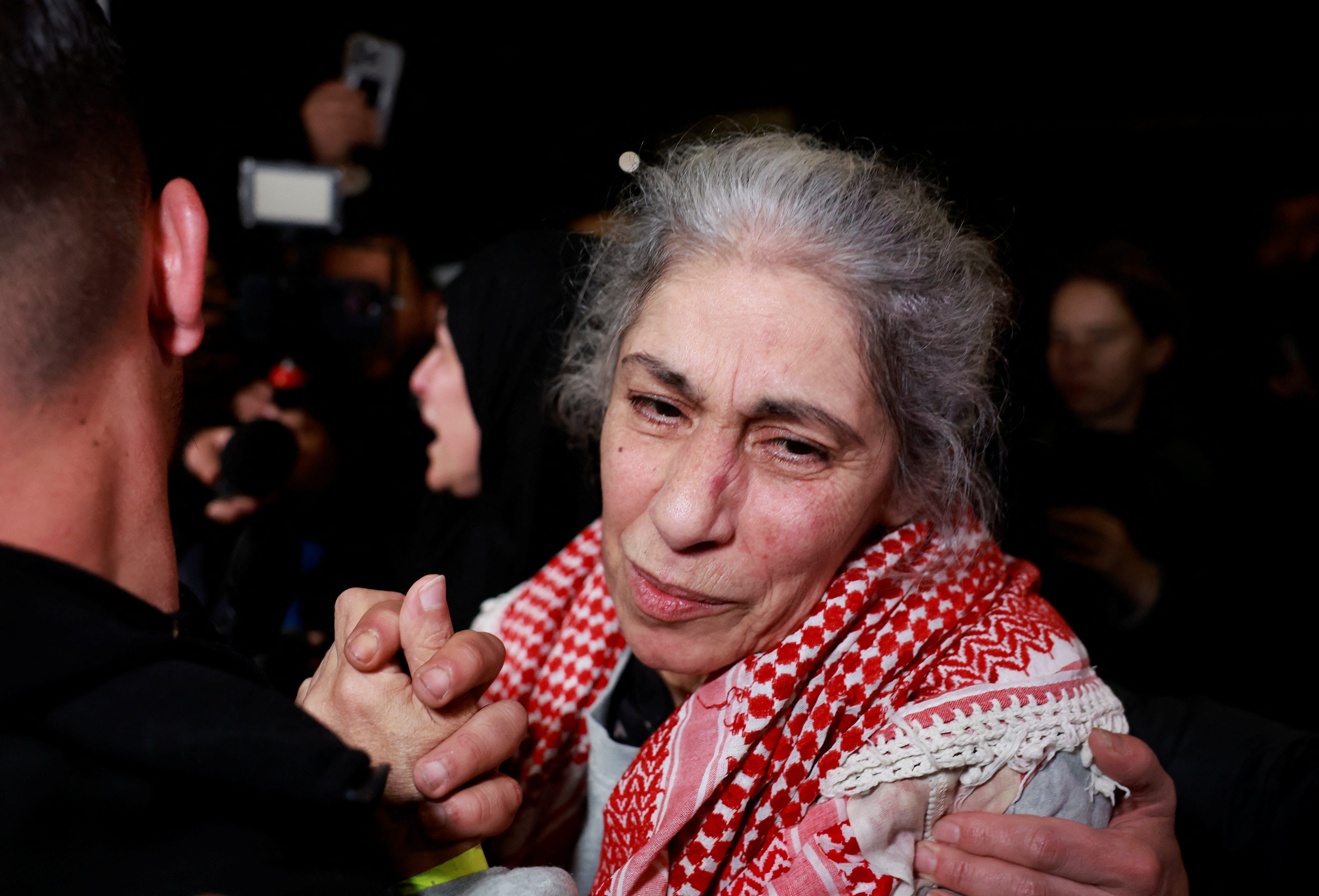 Khaleda Jarar, a freed Palestinian prisoner, is greeted after her release from an Israeli jail as part of a hostages-prisoners swap and a ceasefire deal in Gaza between Hamas and Israel