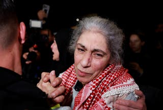 Khaleda Jarar, a freed Palestinian prisoner, is greeted after her release from an Israeli jail as part of a hostages-prisoners swap and a ceasefire deal in Gaza between Hamas and Israel