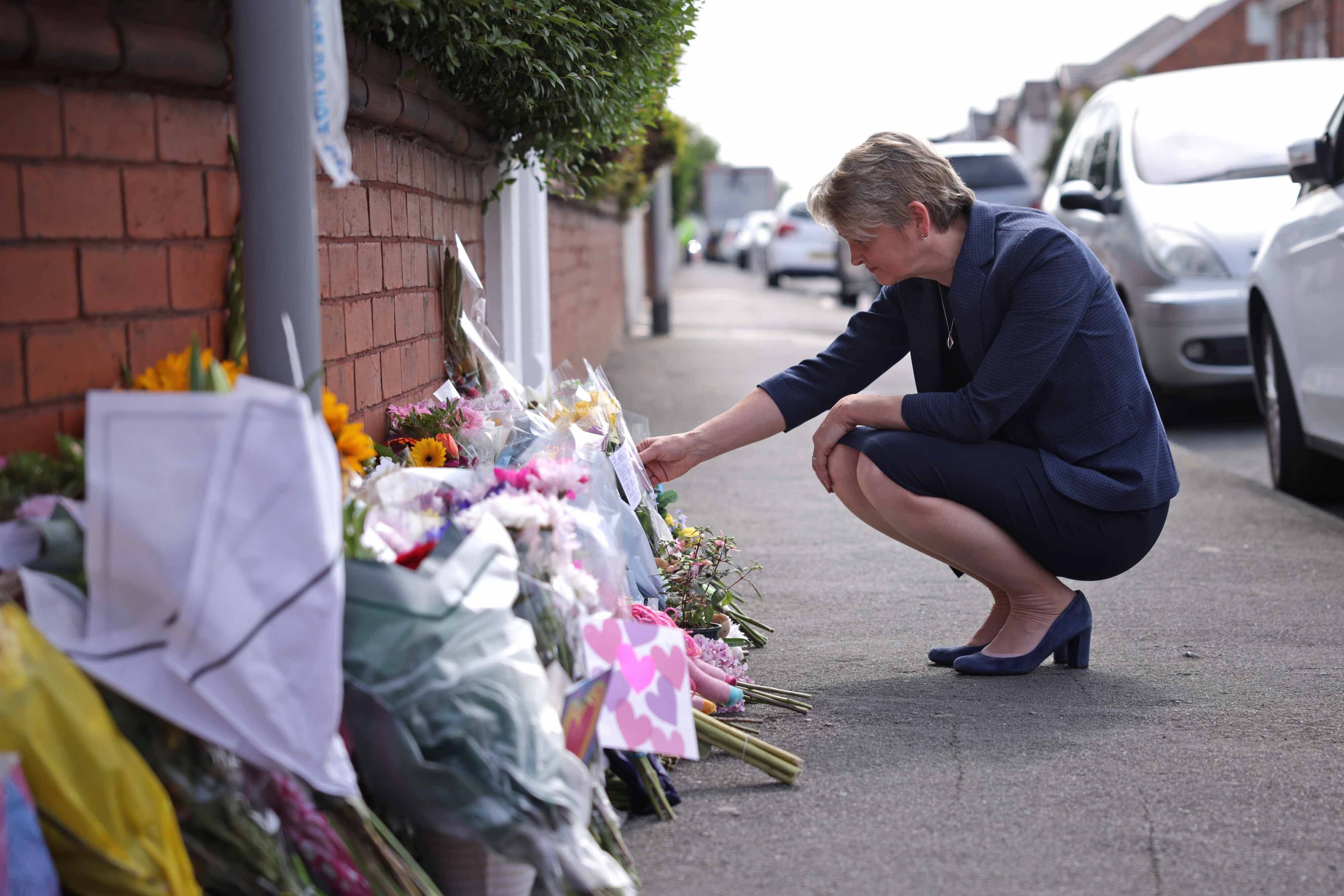 Home secretary Yvette Cooper looks at tributes near the scene of the deadly attack in Hart Street, Southport (James Speakman/PA)