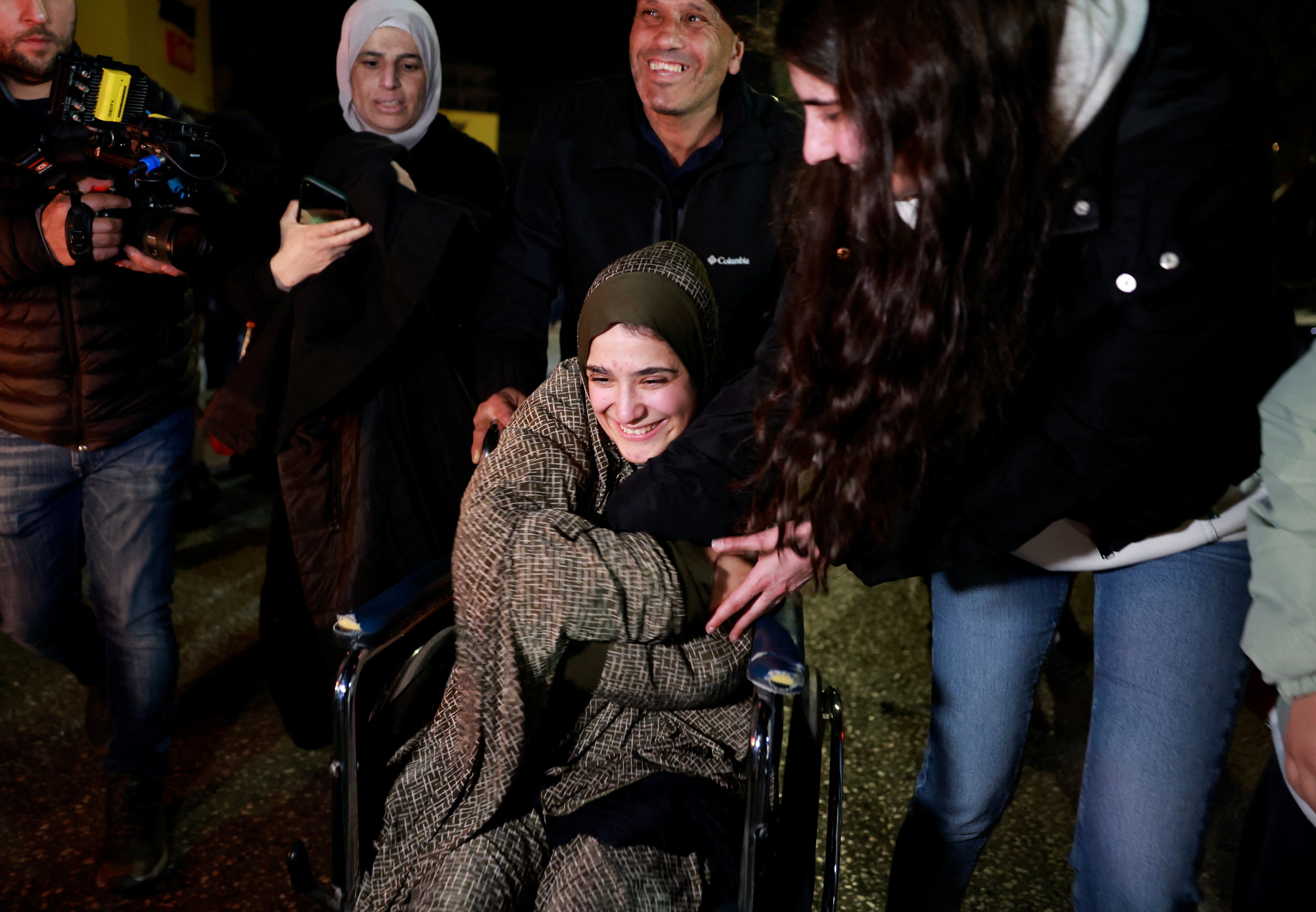 A freed Palestinian prisoner is greeted after being released from an Israeli jail on Monday