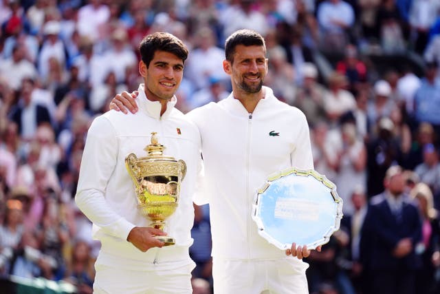 Carlos Alcaraz, left, and Novak Djokovic with their Wimbledon trophies (Mike Egerton/PA)