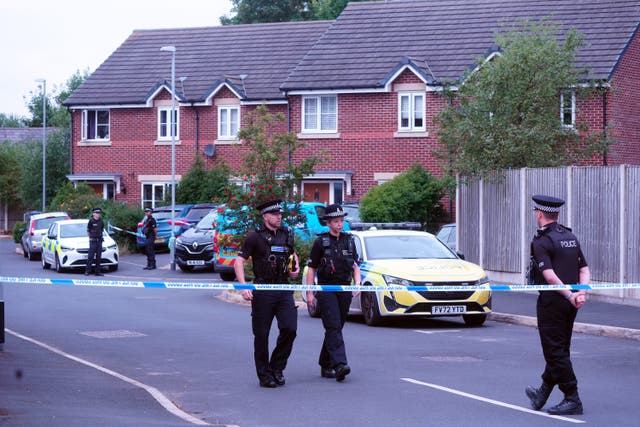 <p>Police near Axel Rudakubana’s home in Old School Close, Banks, near Southport, the day after the murders </p>
