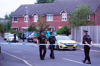 Police near Axel Rudakubana’s home in Old School Close, Banks, near Southport, the day after the murders