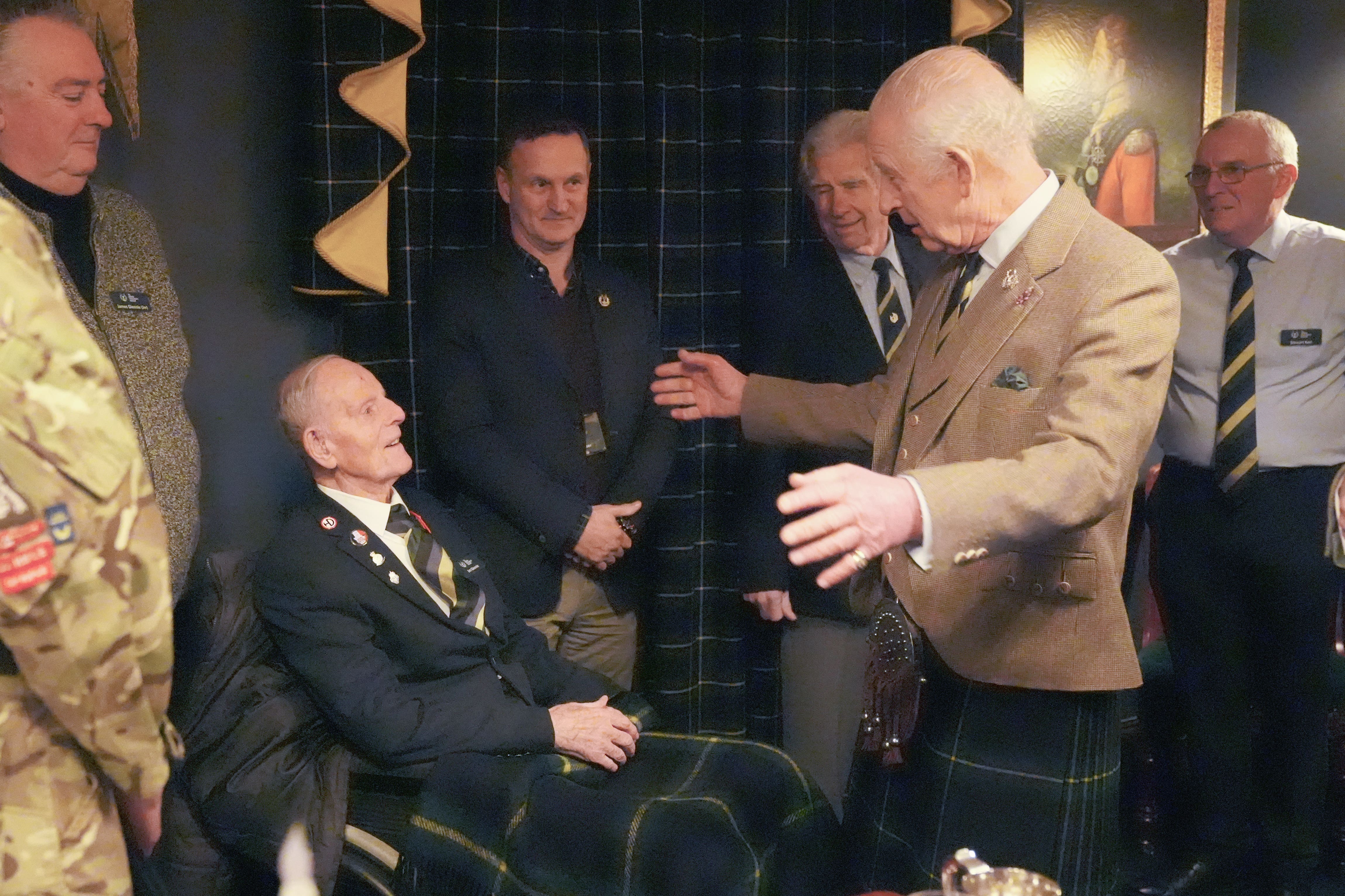 The King meets 99-year-old D-Day veteran Jim Glennie at the Gordon Highlanders Museum in Aberdeen (Andrew Milligan/PA)