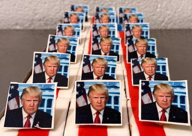 <p>Pastries decorated with an edible picture of Trump are presented at a bakery in Freinsheim, Germany to mark his second inauguration</p>