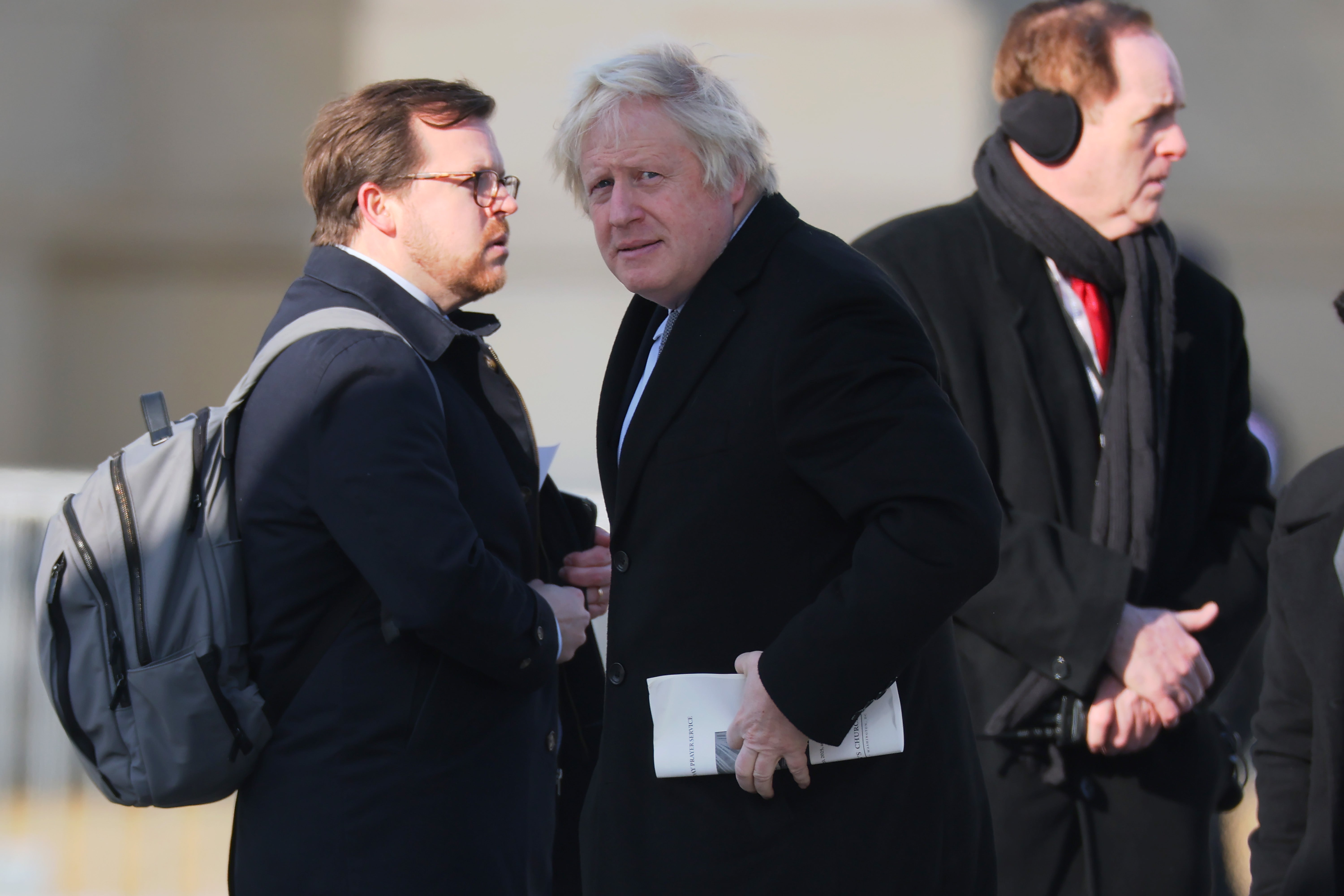 Former British Prime Minister Boris Johnson (C) arrives for the inauguration ceremony