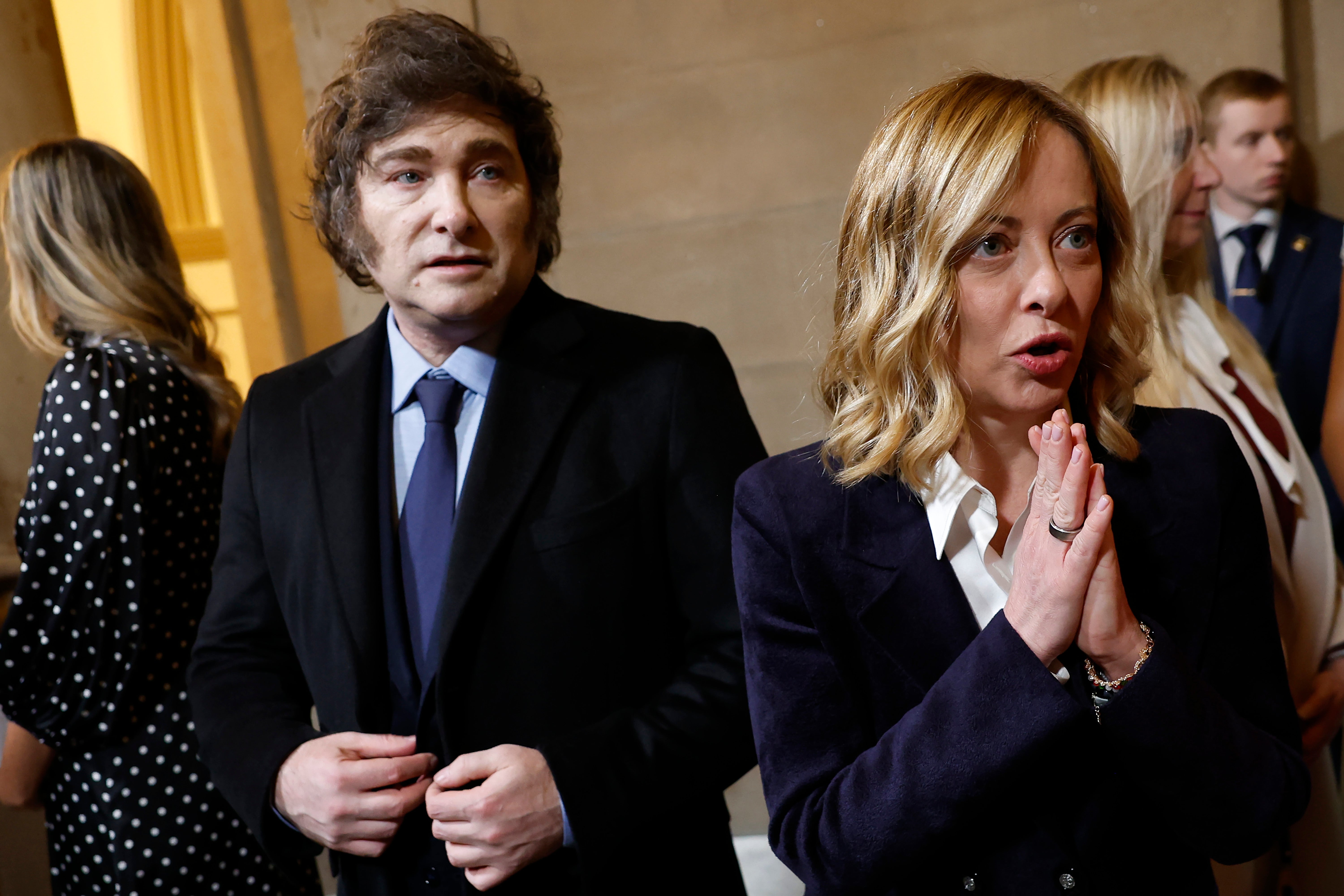 President of Argentina Javier Milei (L) and Prime Minister of Italy Giorgia Meloni arrive to the inauguration of U.S. President-elect Donald Trump in the Rotunda of the U.S. Capitol on January 20, 2025 in Washington, D.C.