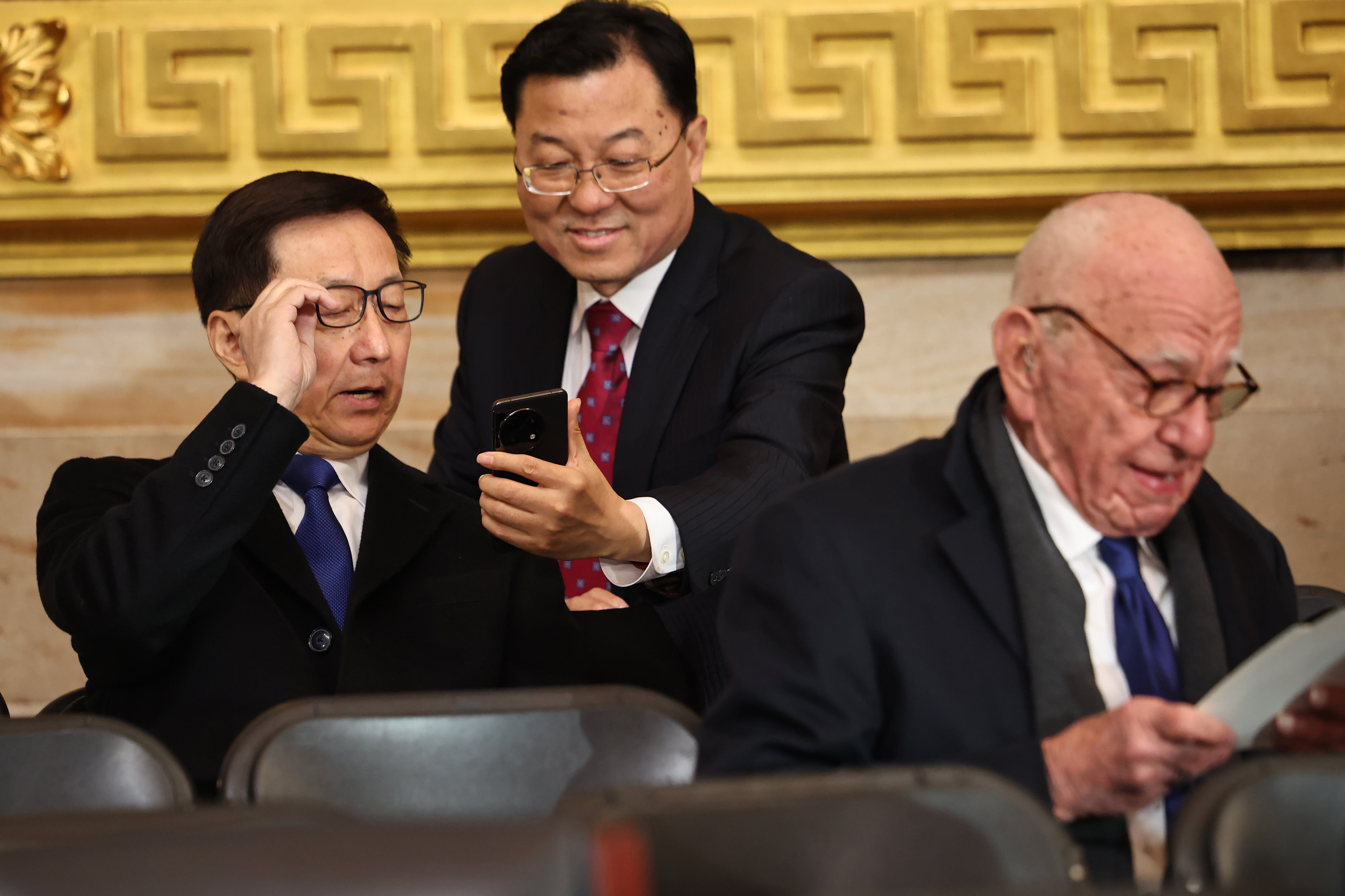 Vice President of China Han Zheng (L) and Former Executive Chairman of Fox Corp Rupert Murdoch (R) attend the inauguration of U.S. President-elect Donald Trump in the Rotunda of the U.S. Capitol on January 20, 2025 in Washington, D.C.