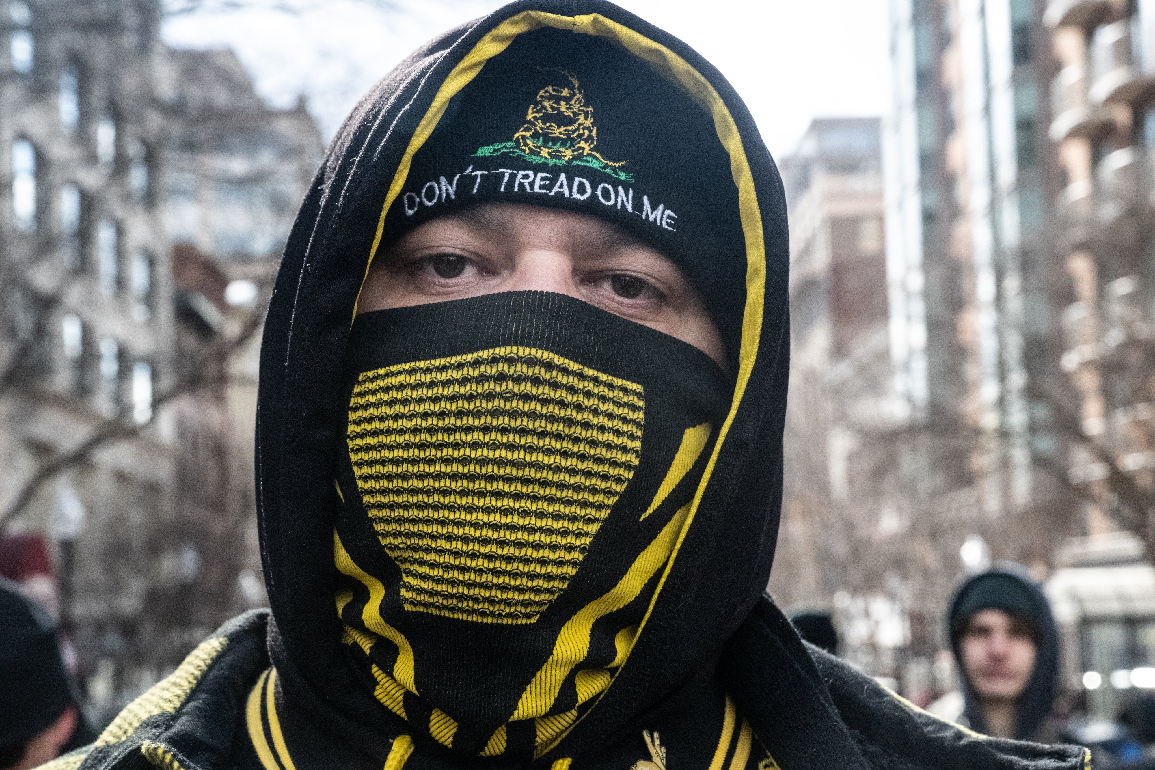 A member of the Proud Boys walks in DC to celebrate Trump’s inauguration