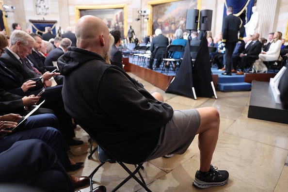 The senator wore gray gym shorts and a hoodie