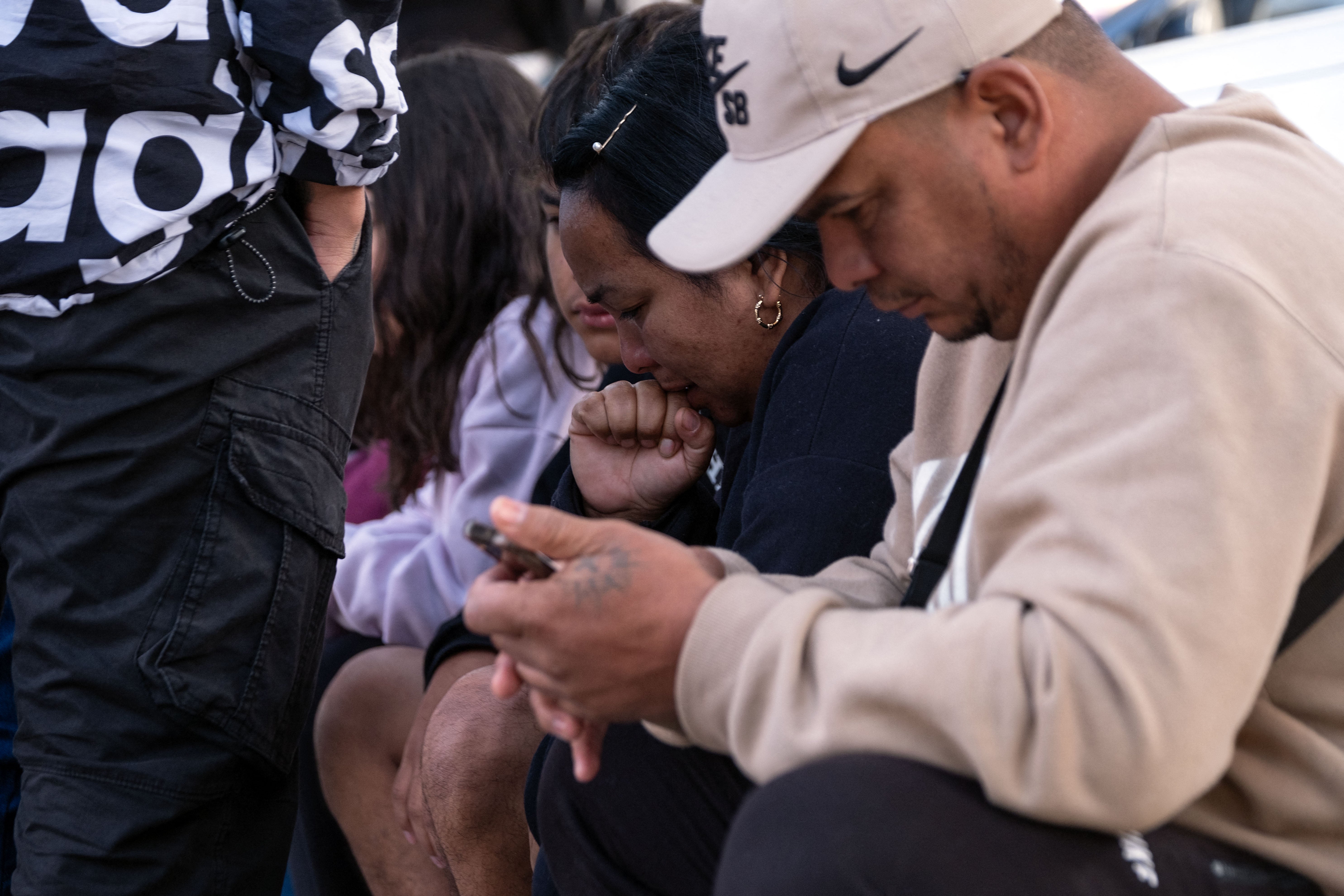 Asylum seekers react as they wait for news on their CBP One appointments January 20. Moments after Trump’s inauguration, all appointments were canceled