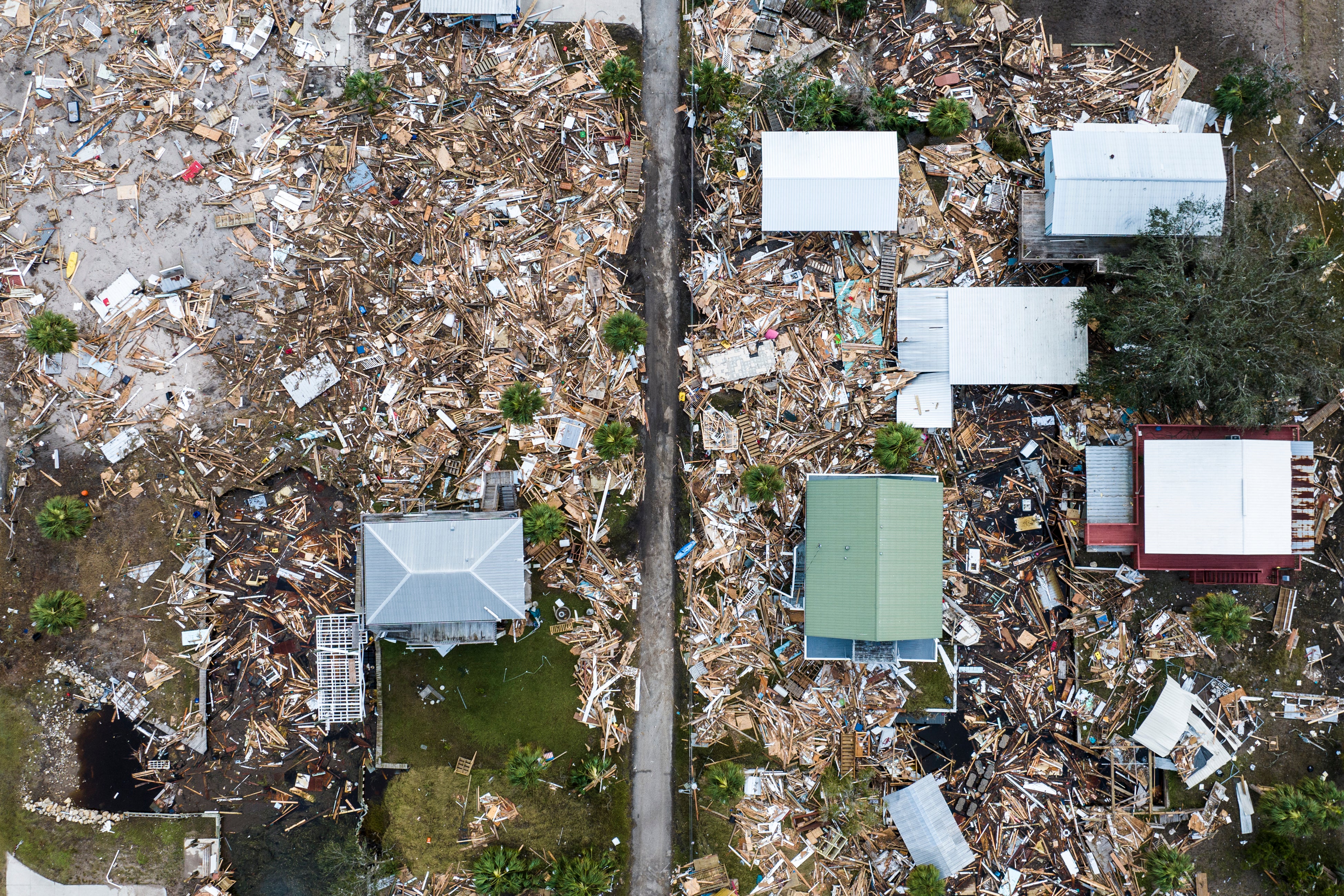 An aerial view shows debris from damaged houses after Hurricane Helene made landfall in Horseshoe Beach, Florida, last September. The deadly storm was made faster by climate change