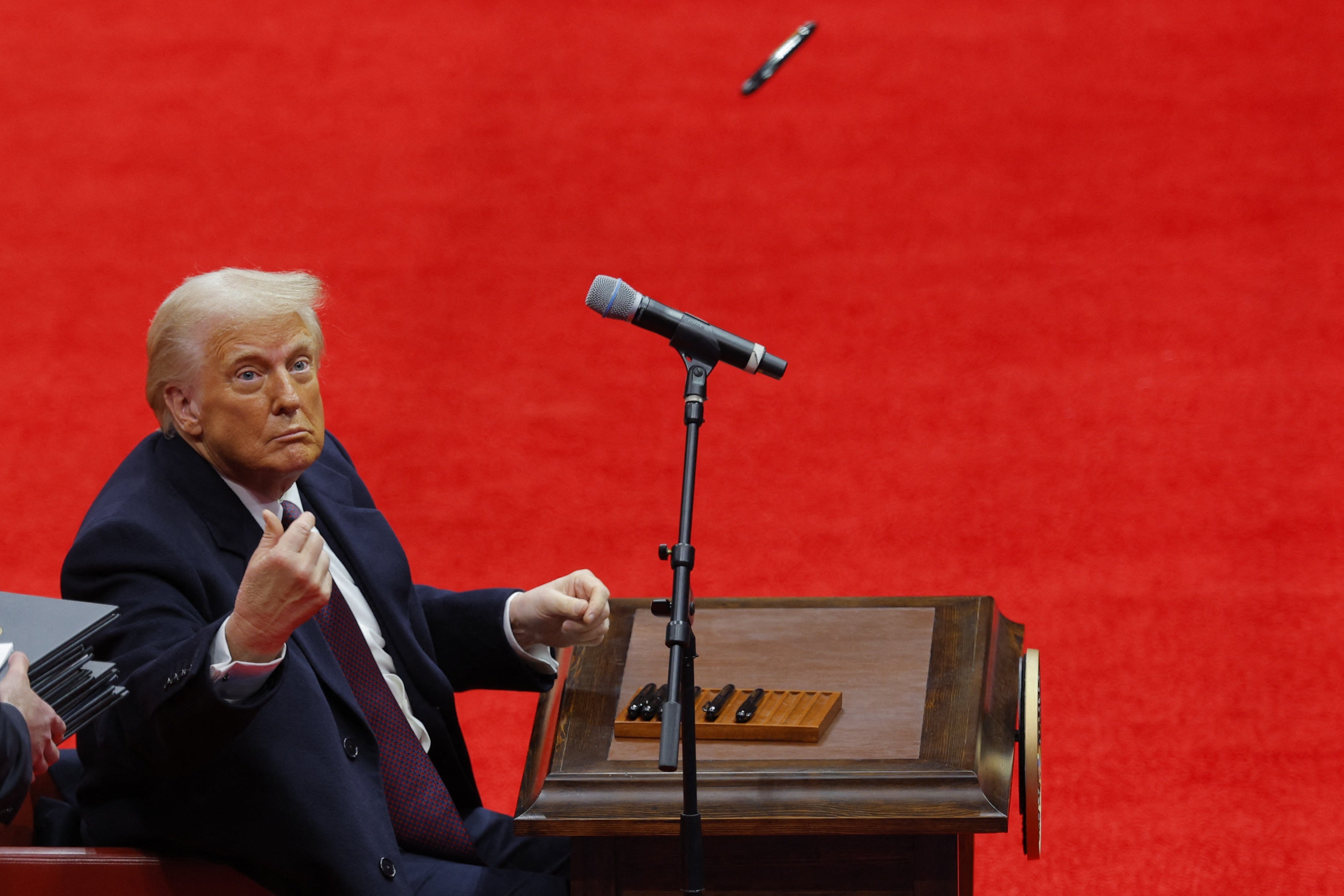 President Donald Trump looks on after signing executive orders inside the Capital One Arena on the inauguration day of his second presidential term, in Washington, U.S. January 20, 2025. REUTERS/Brian Snyder