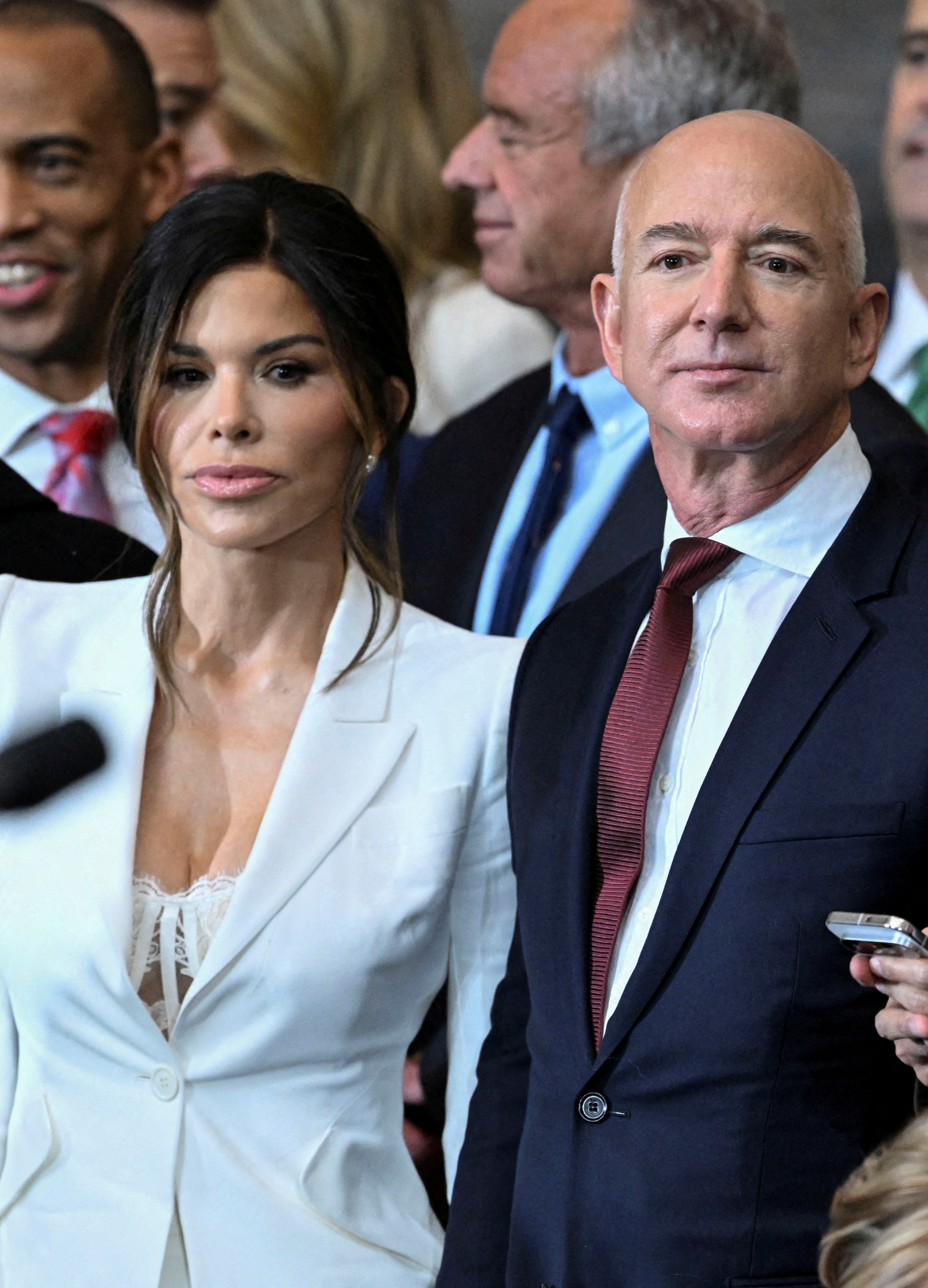 Sanchez, with Jeff Bezos at the inauguration, divided opinion with her outfit