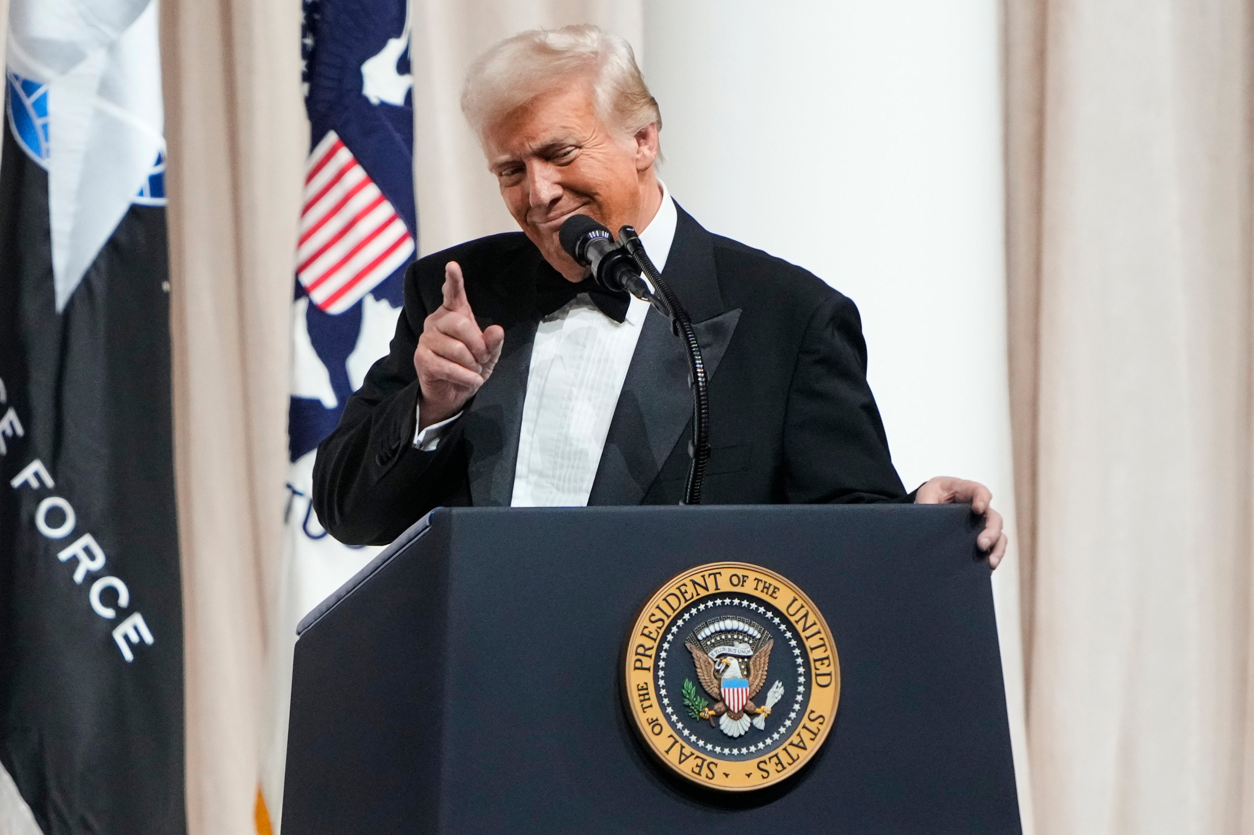 President Donald Trump speaks on stage at the Commander in Chief Ball, part of the 60th Presidential Inauguration, Monday, Jan. 20, 2025, in Washington. (AP Photo/Ben Curtis)