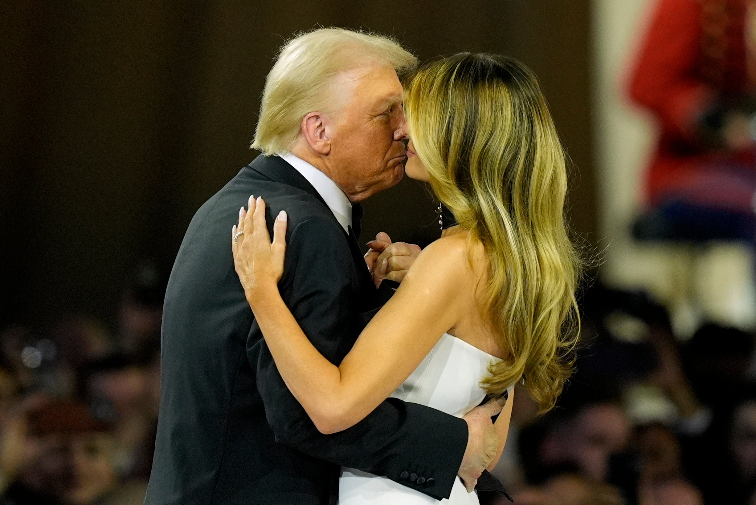 Her outfit consisted of a white strapless gown with black line detailing wrapped around it. She paired the look with a matching black choker necklace that had a silver pendant on it