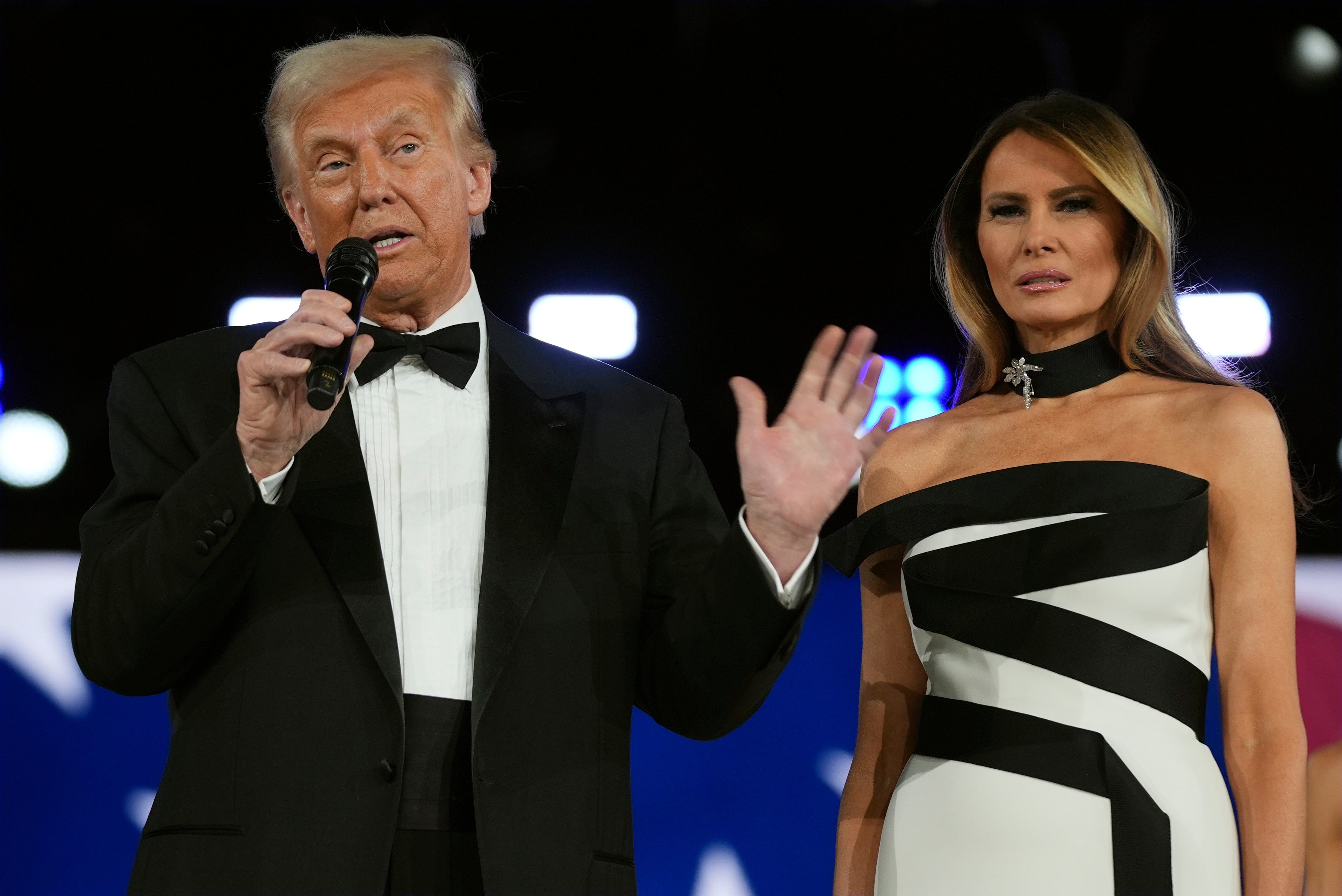 The first lady looks on as her husband gives his latest speech in a packed day