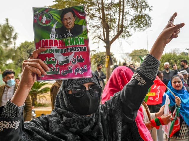 <p>Pakistan’s imprisoned former prime minister Imran Khan’s supporters hold Khan’s portrait during a protest in Peshawar on 17 January 2025</p>