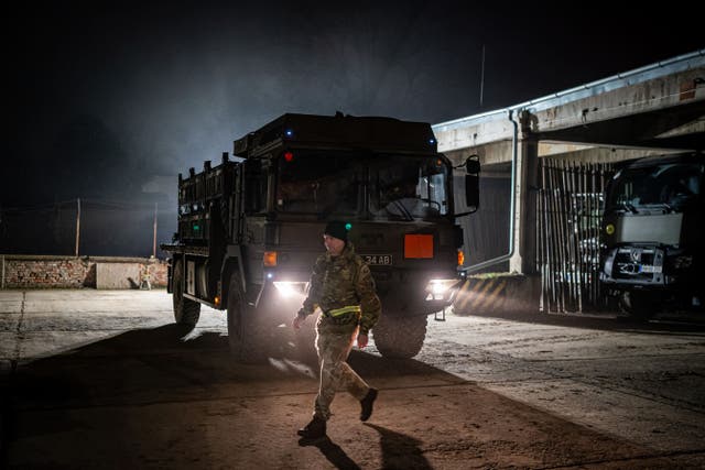 A British military vehicle arrives at a Hungarian military base (Ben Birchall/PA)