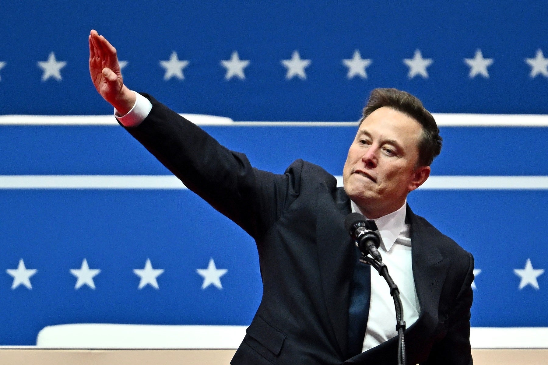 Tesla and SpaceX CEO Elon Musk gestures as he speaks during the inaugural event in Washington, DC, on January 20