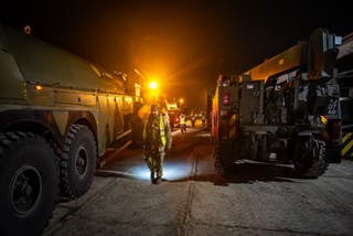 British military vehicles are inspected as they arrive at a Hungarian military base at Szentes