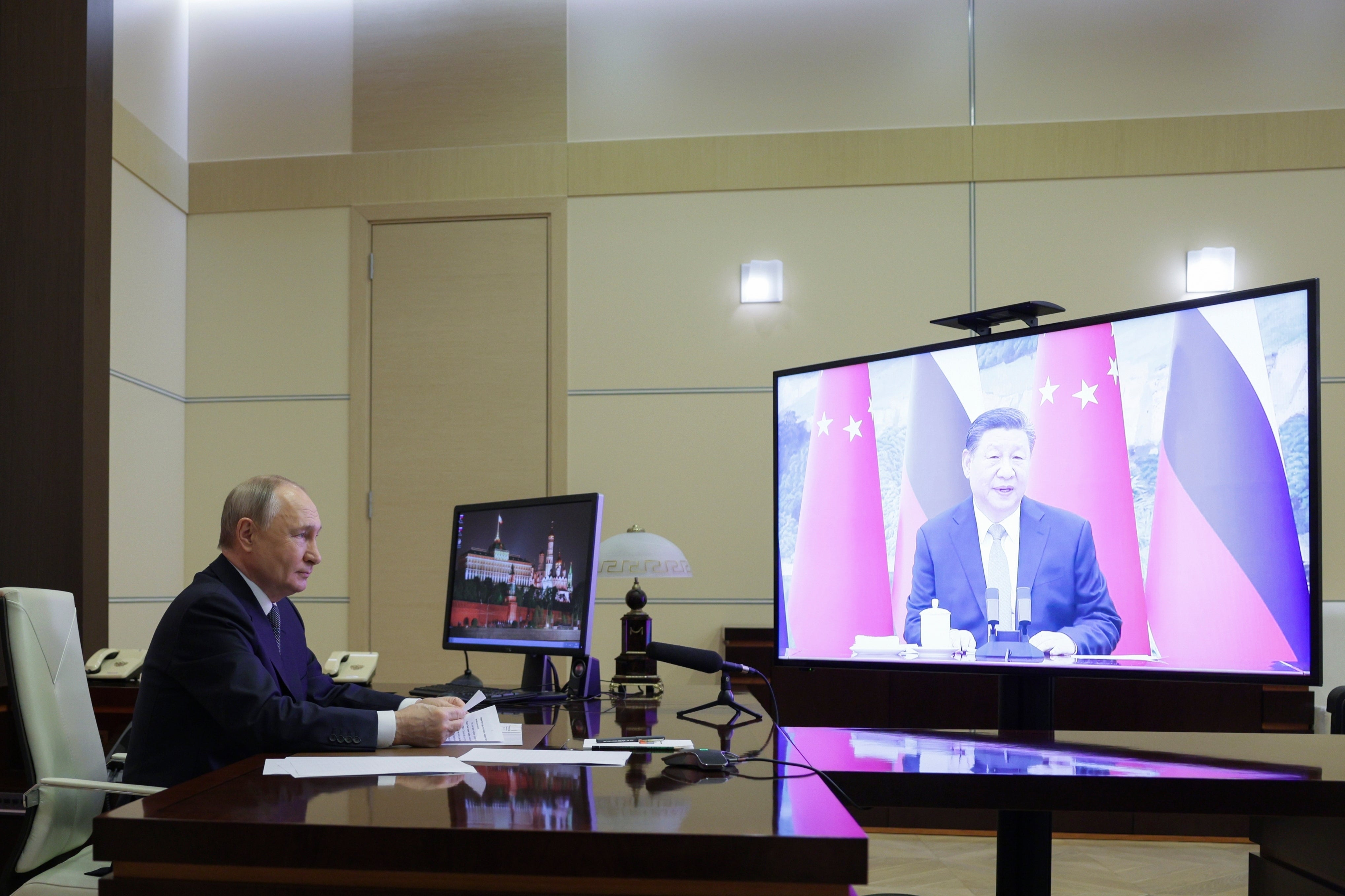 <p>Russian President Vladimir Putin speaks with Chinese President Xi Jinping via videoconference at Novo-Ogaryovo state residence</p>