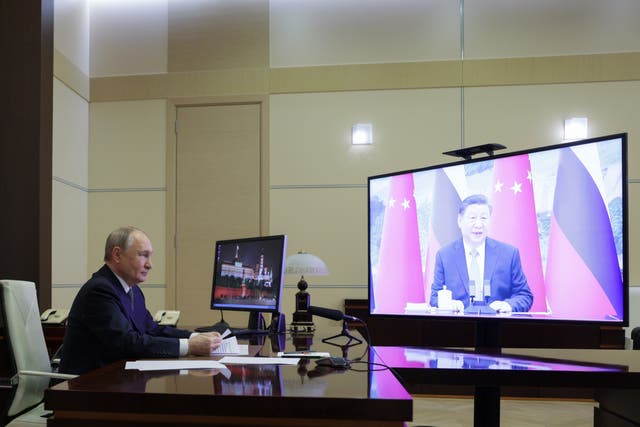 <p>Russian President Vladimir Putin speaks with Chinese President Xi Jinping via videoconference at Novo-Ogaryovo state residence</p>