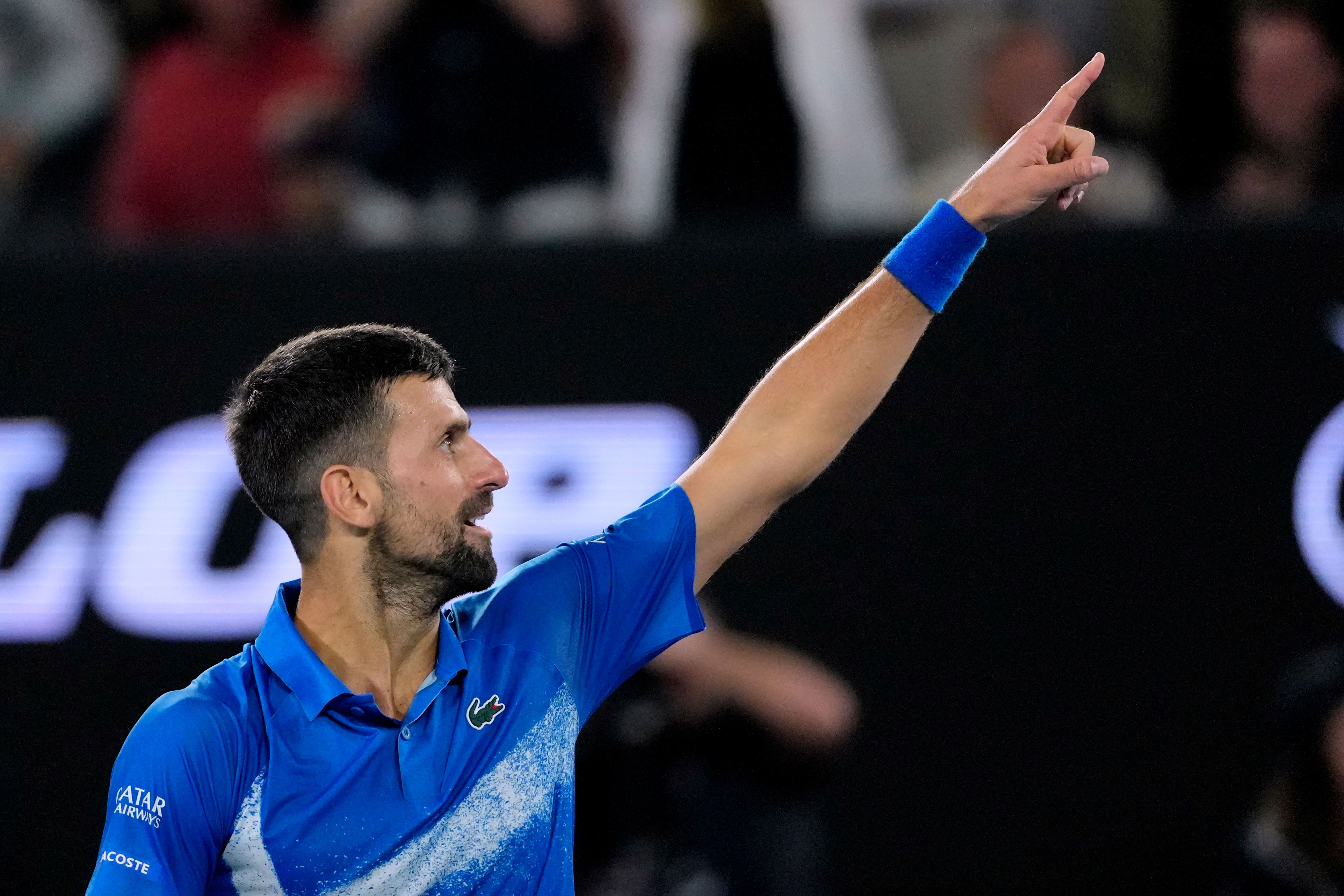 Novak Djokovic gestures to the crowd (Vincent Thian/AP)