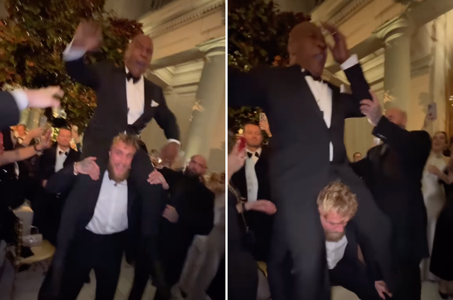 <p>Jake Paul hoists Mike Tyson on his shoulders</p>