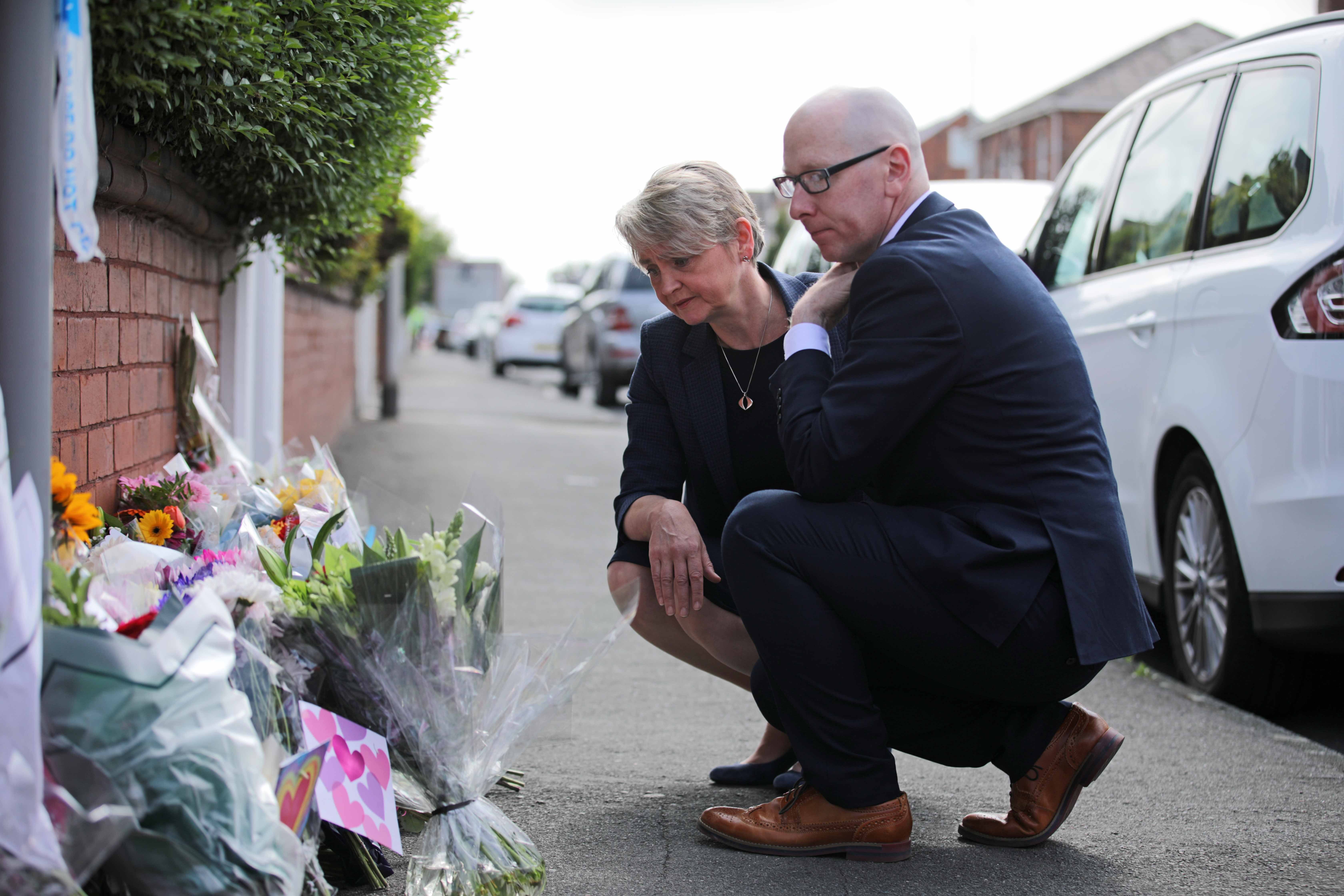 Home Secretaries Yvet Cooper and Mr. Hurley left the flowers as a tribute to Ellis da Silva Agyir, Babe King and Elsey.com Stancomb