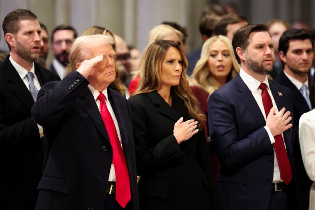 <p>Donald Trump continues to salute during the national anthem despite others around him taking a different approach </p>