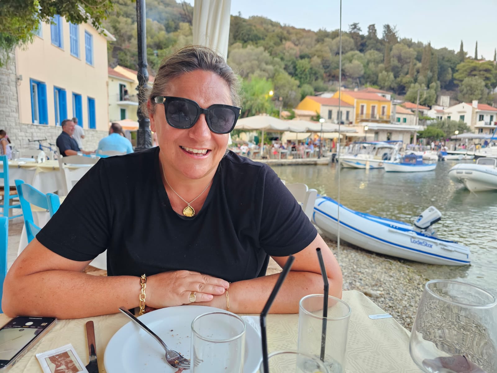 Victoria in one of the handful of waterside restaurants in Kioni