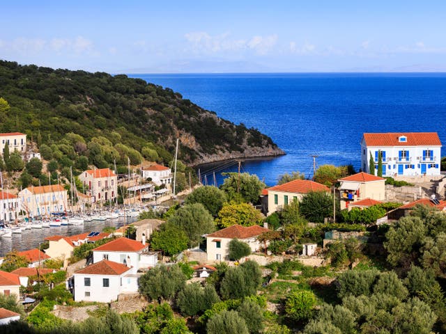 <p>A view of the blue-shuttered apartment overlooking the bay of Kioni</p>
