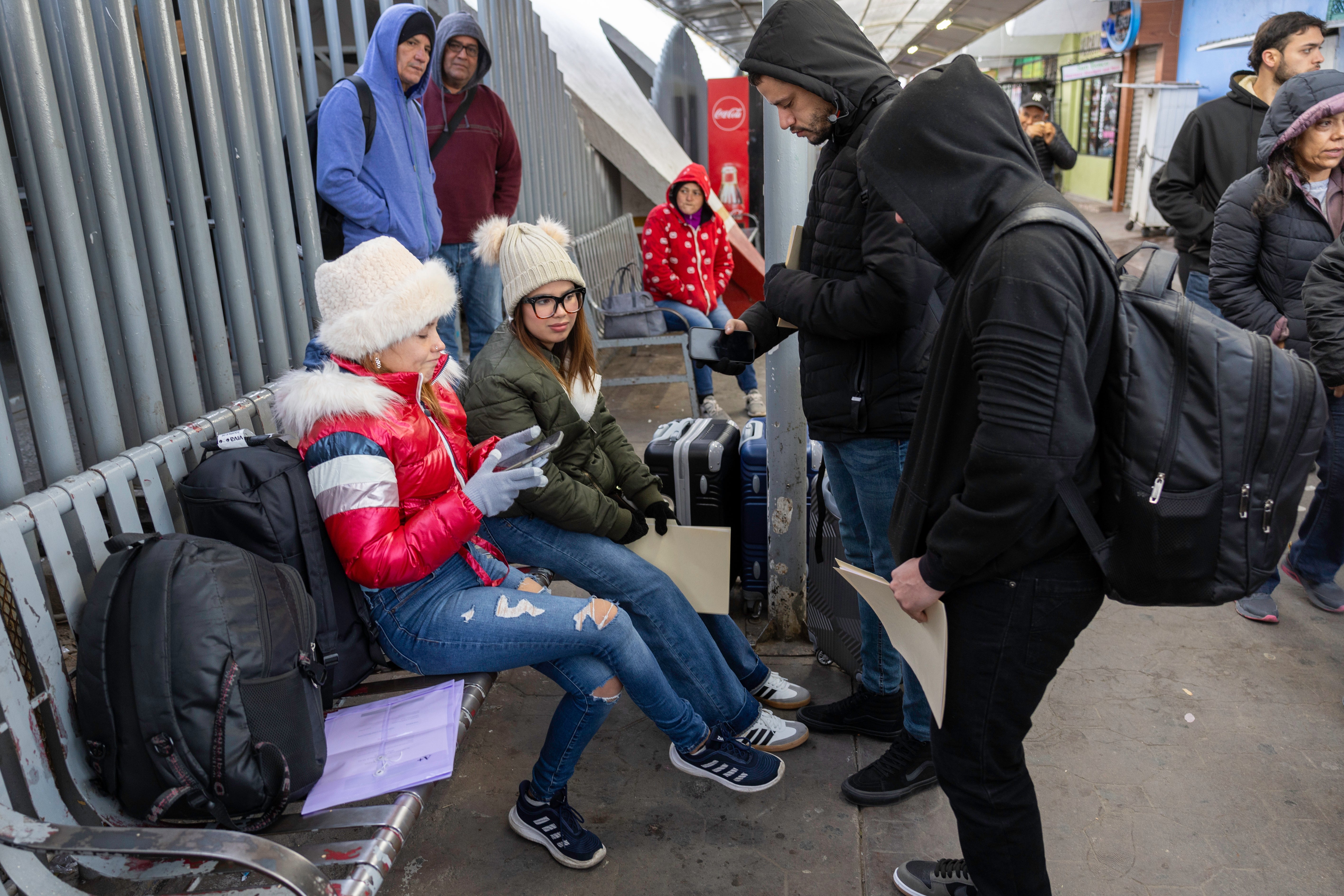 A family from Venezuela tries in vain to access the CBP One app a day after the second inauguration of President Donald Trump