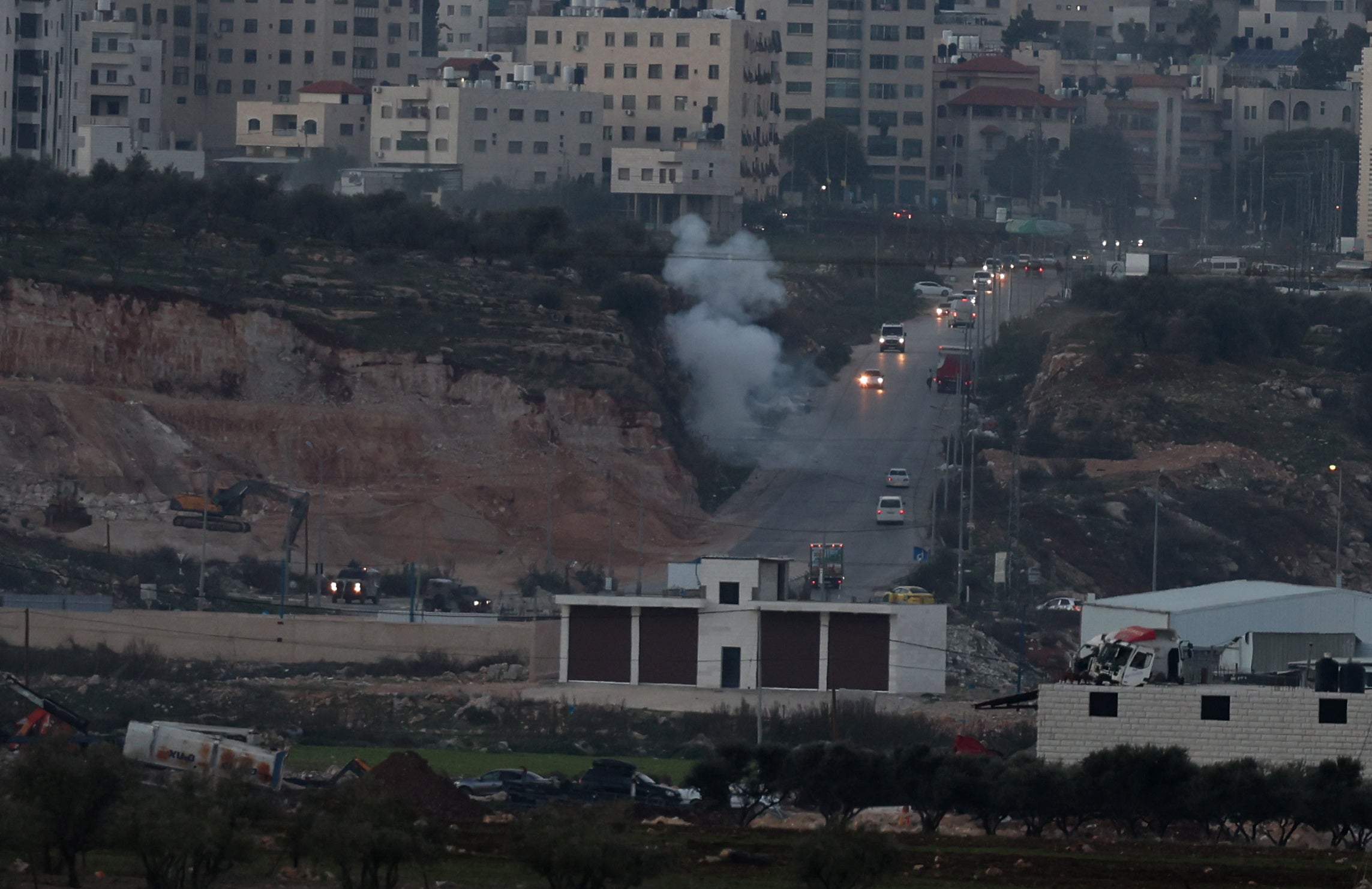 Smoke rises during clashes with Israeli forces near the checkpoint of Bet Forik at the entrance of Nablus, West Bank