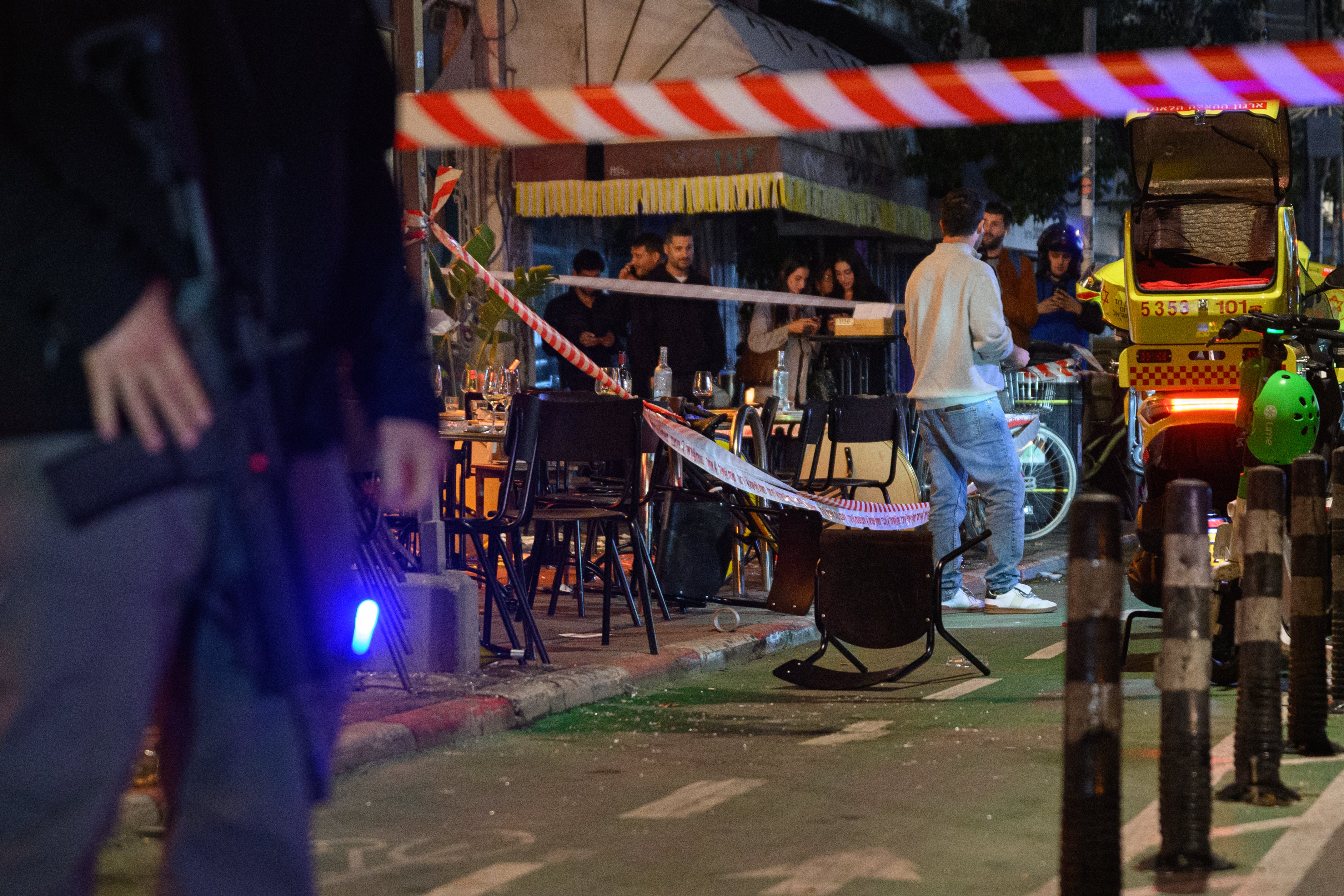 Police block off the area of a restaurant after a stabbing that left four people wounded on 21 January 2025 in Tel Aviv, Israel