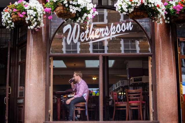 <p>Wetherspoon says many of its drinks will be 15p more expensive (Victoria Jones/PA)</p>