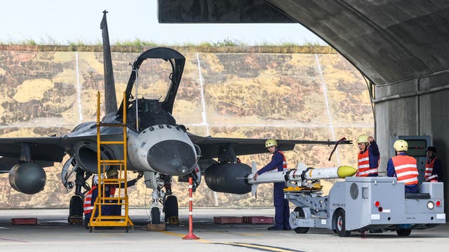 <p>File: Taiwanese Air Force ground crew mount a missile onto an Indigenous Defense Fighter aircraft </p>