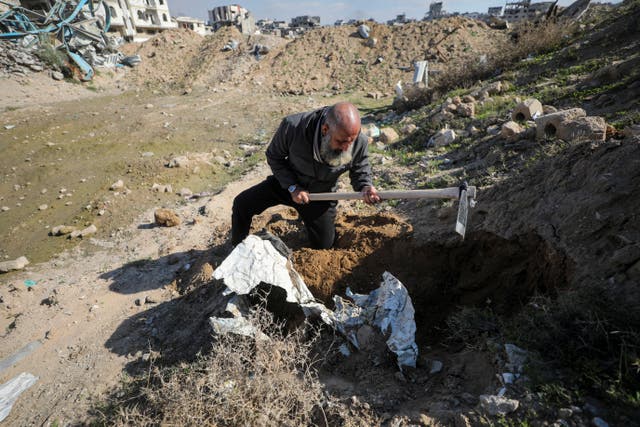 <p>Palestinian man Atef Jundiya searches for the graves and bodies of his father, brother, and brother-in-law</p>