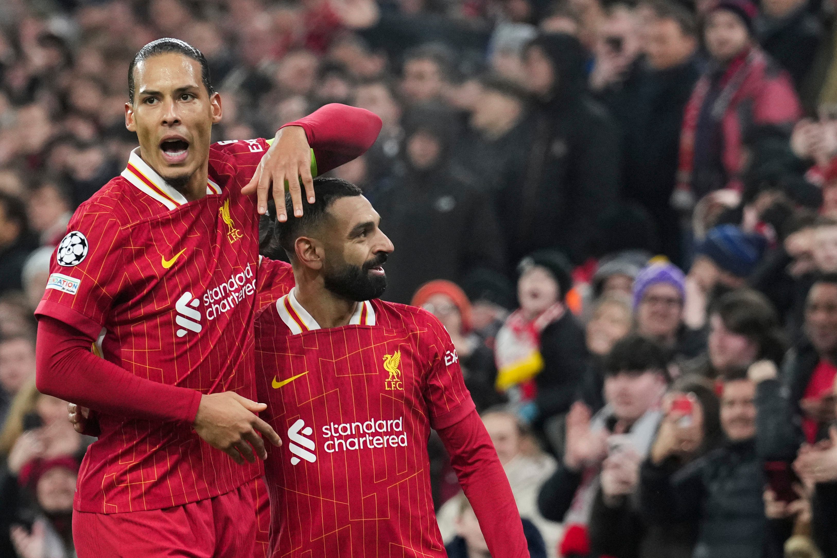 Virgil van Dijk, left, celebrates with Mohamed Salah (Jon Super/AP)