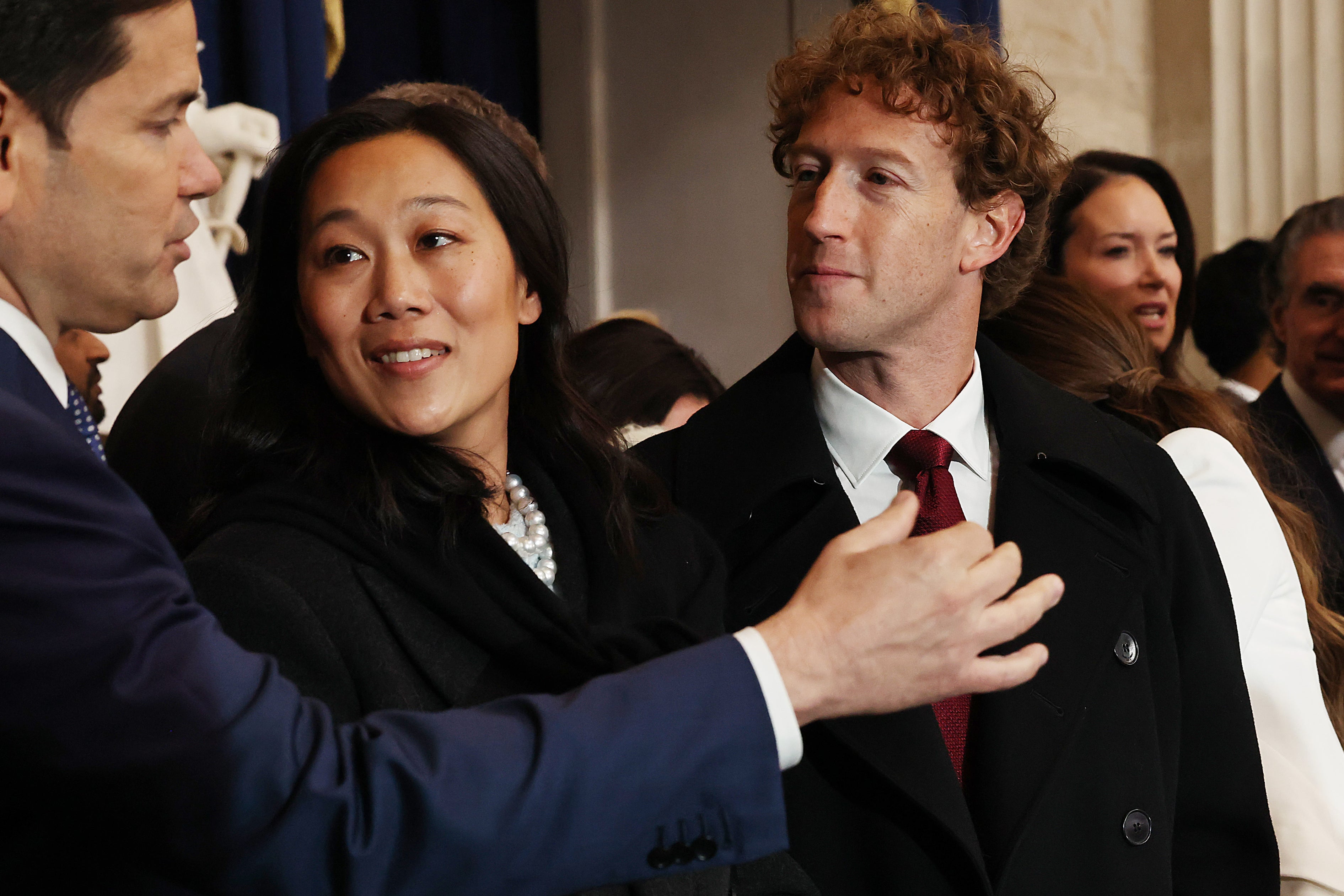 Mark Zuckerberg and his wife Priscilla Chan speak with Marco Rubio (left) at the US Capitol