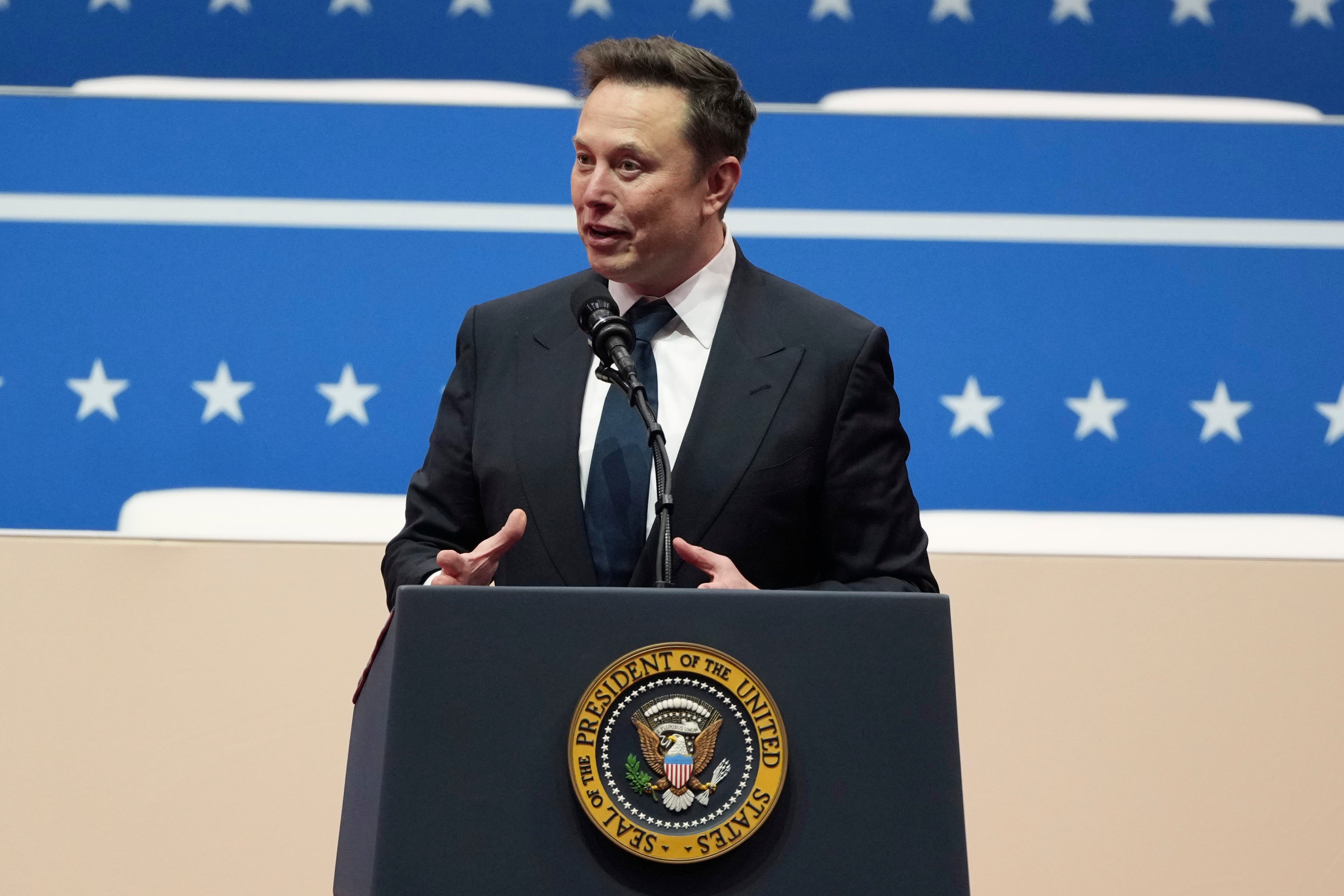 Elon Musk speaks at an indoor Presidential Inauguration parade event in Washington (Matt Rourke/AP)