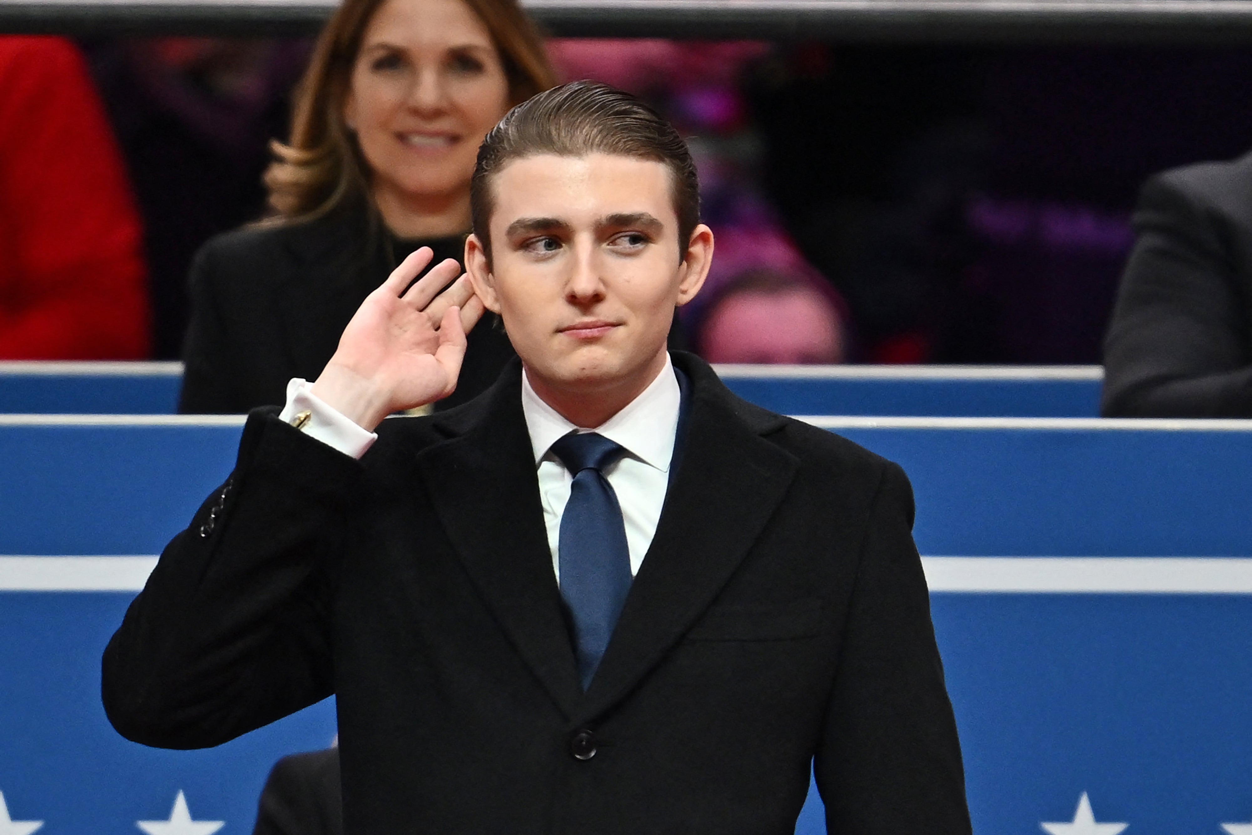 Barron Trump gestures after being acknowledged by his father US President Donald Trump during the inaugural parade. A classmate and president of NYU’s College Republicans called the first son an ‘oddity’ — a week later, she resigned