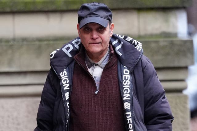 <p>Mustaq Ahmed, 66, pictured arriving at Minshull Street Crown Court in Manchester </p>