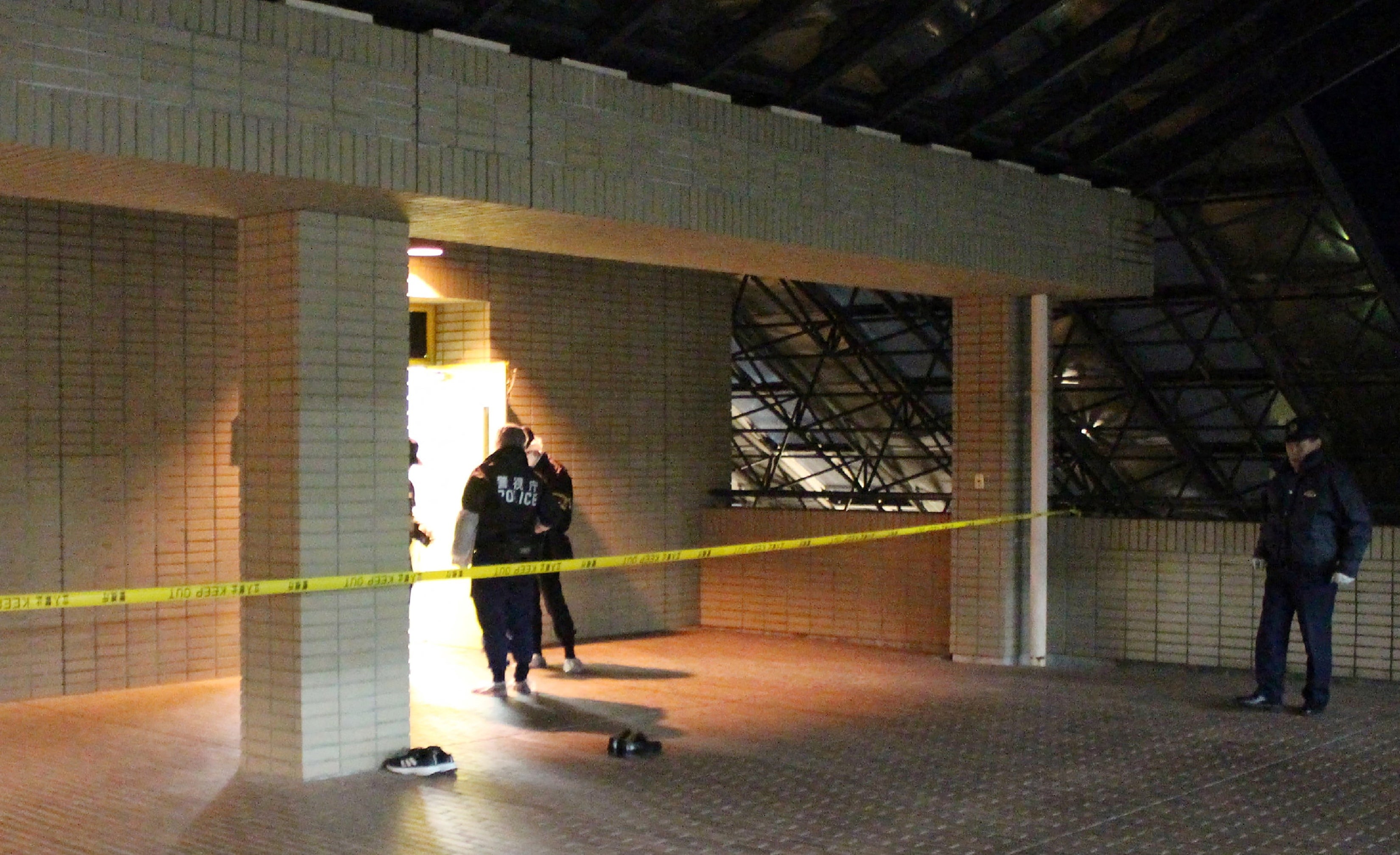 File. Police arrive at the scene after a woman brandished a hammer inside a classroom at Hosei University's Tama campus in Machida in the western suburbs of Tokyo