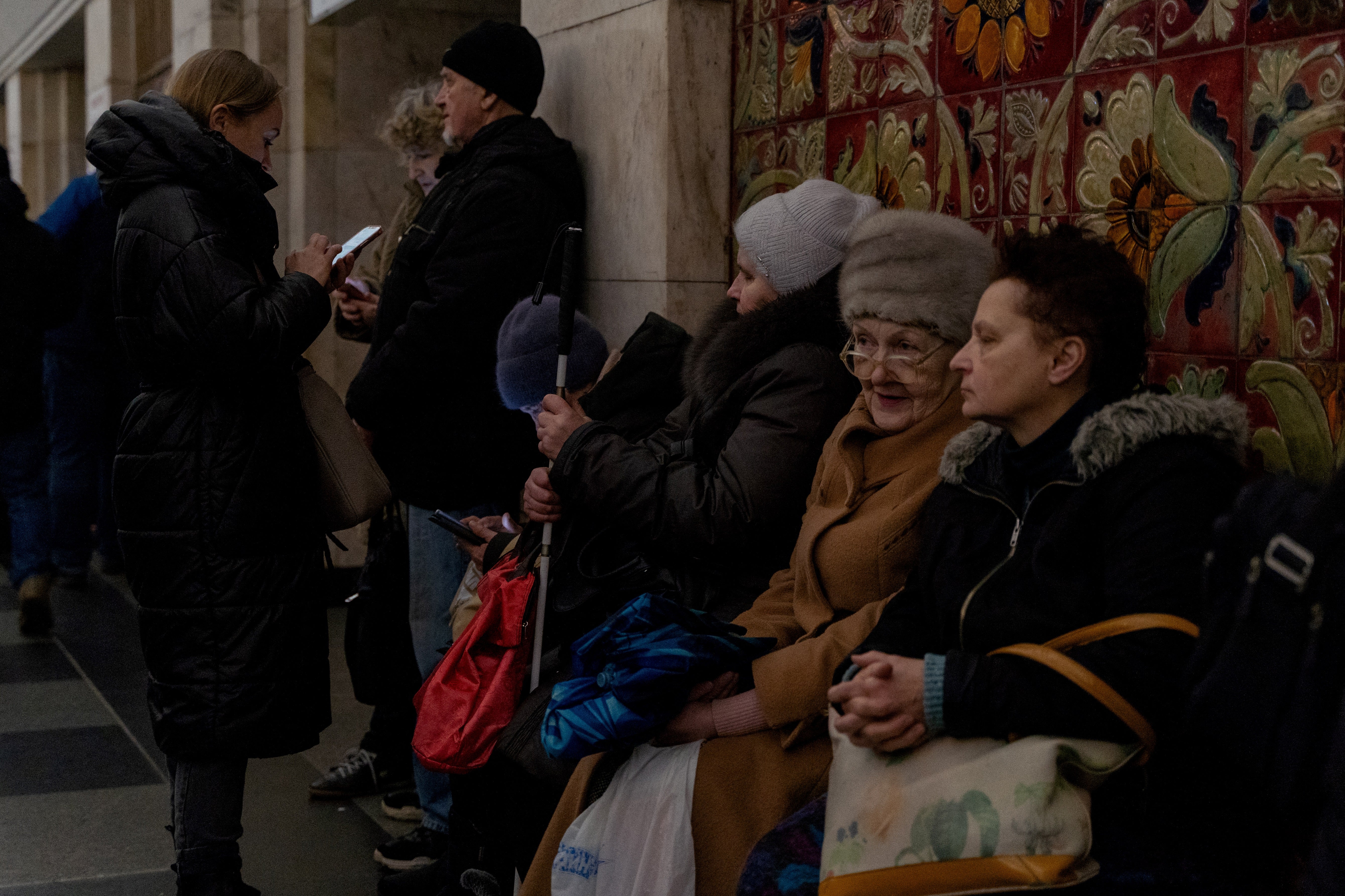 Residents take shelter in a metro station after an air raid warning was issued in Kyiv