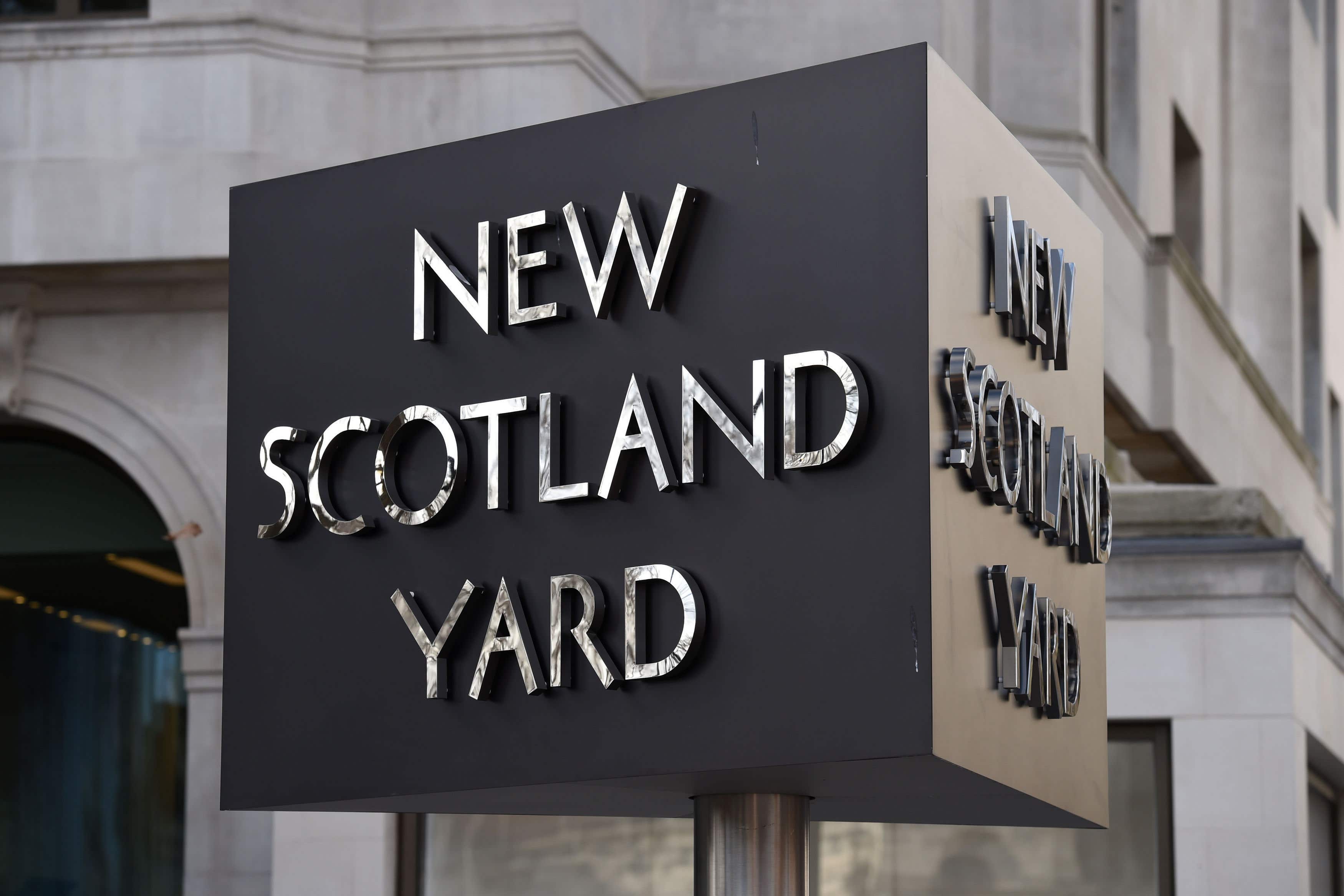 A New Scotland Yard sign outside the Curtis Green building on Victoria Embankment in London, as construction work continues on the new headquarters for the Metropolitan Police.