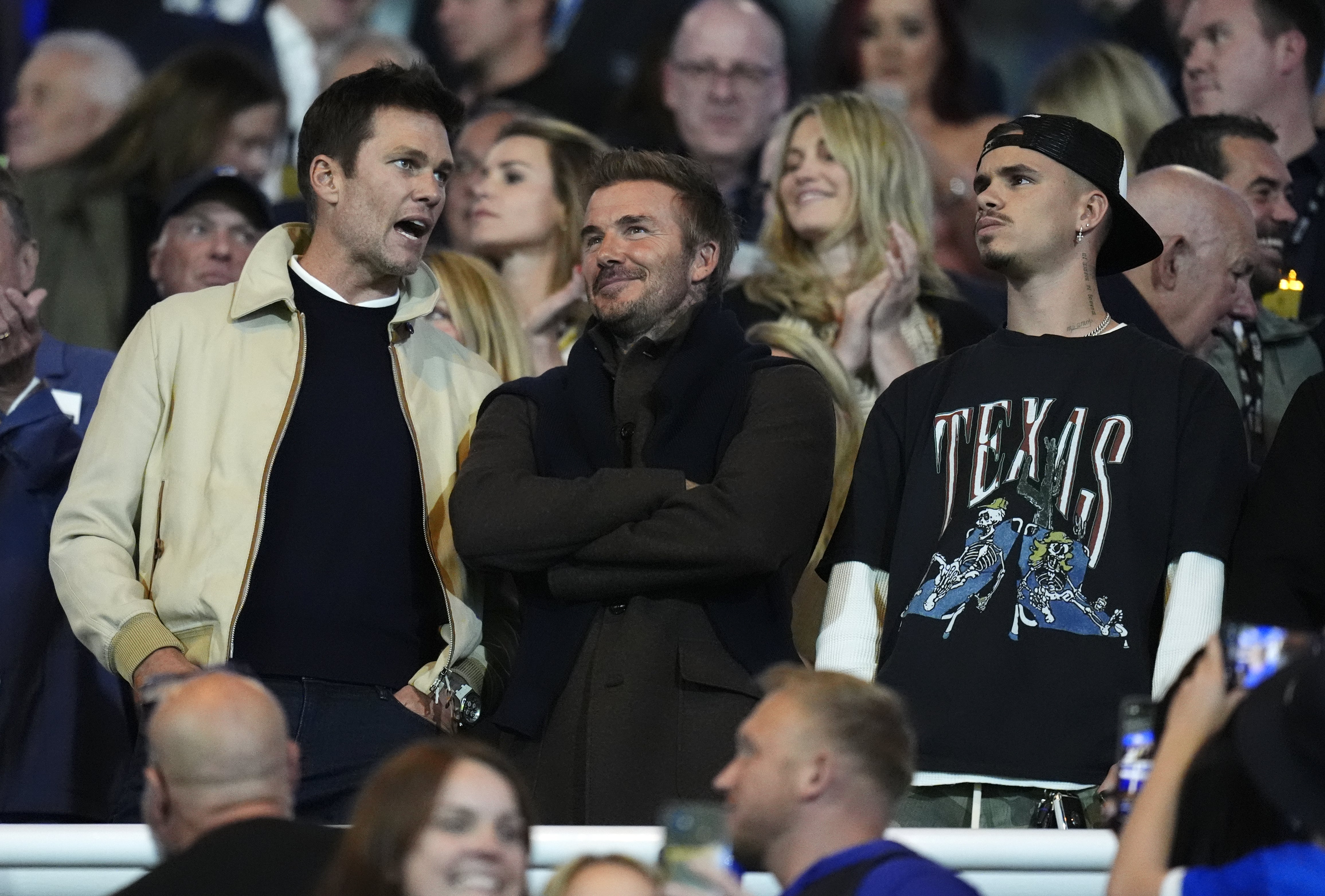 Birmingham City co-owner Tom Brady (left) and former England captain David Beckham with his son Romeo