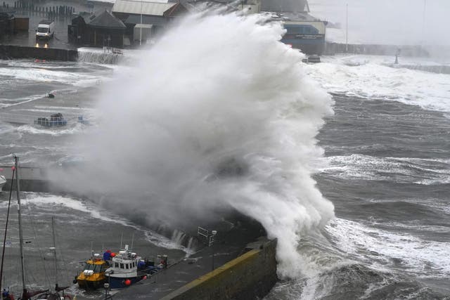 Gusts of up to 100mph are possible in the red warning area (Andrew Milligan/PA)